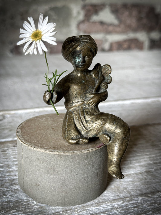 A Delightful Antique Bronze Decorative Seated Cherub