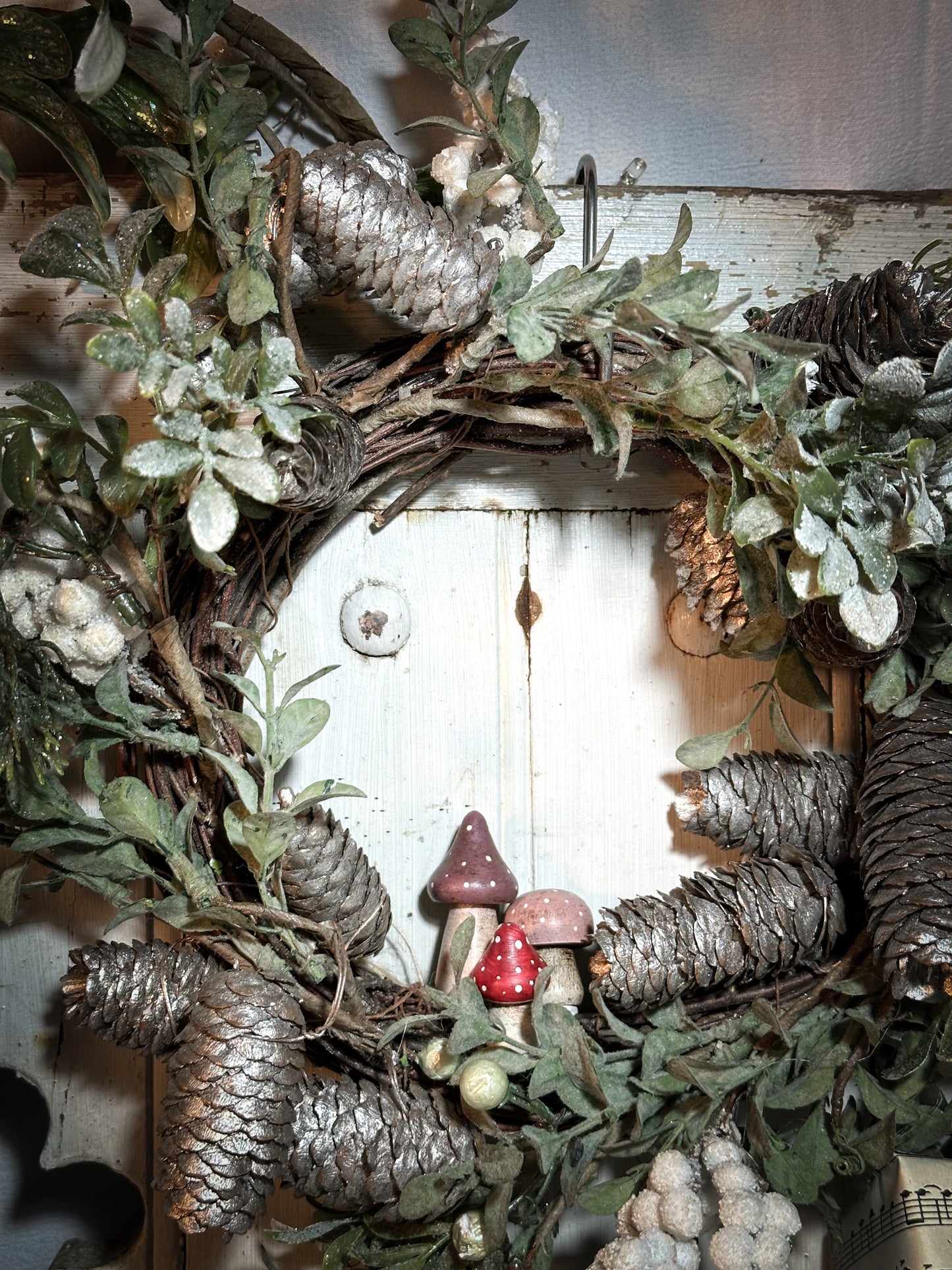 A wooden hand painted and trimmed Christmas village toadstool