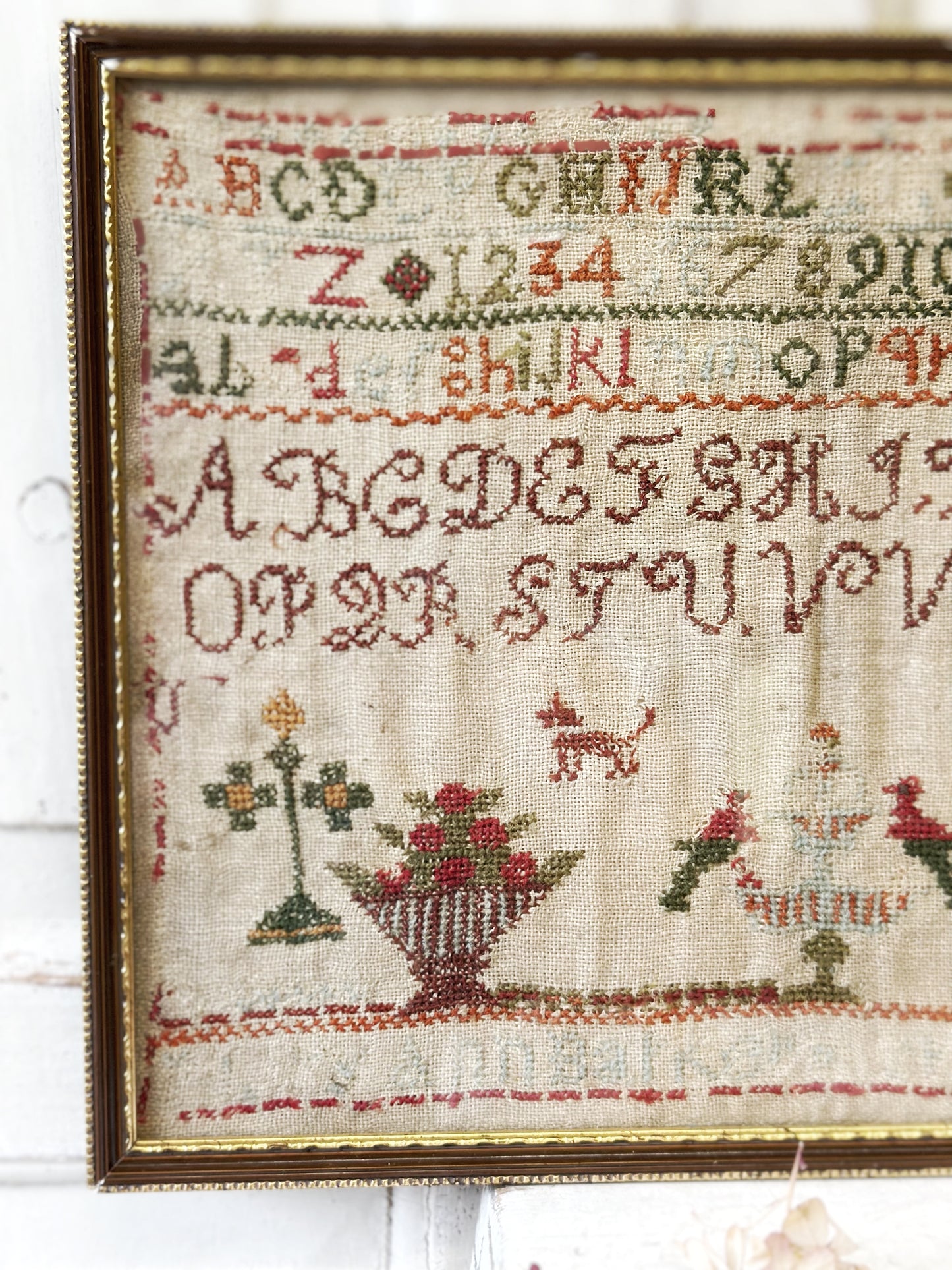 A beautiful 19th century colourful antique needlework sampler