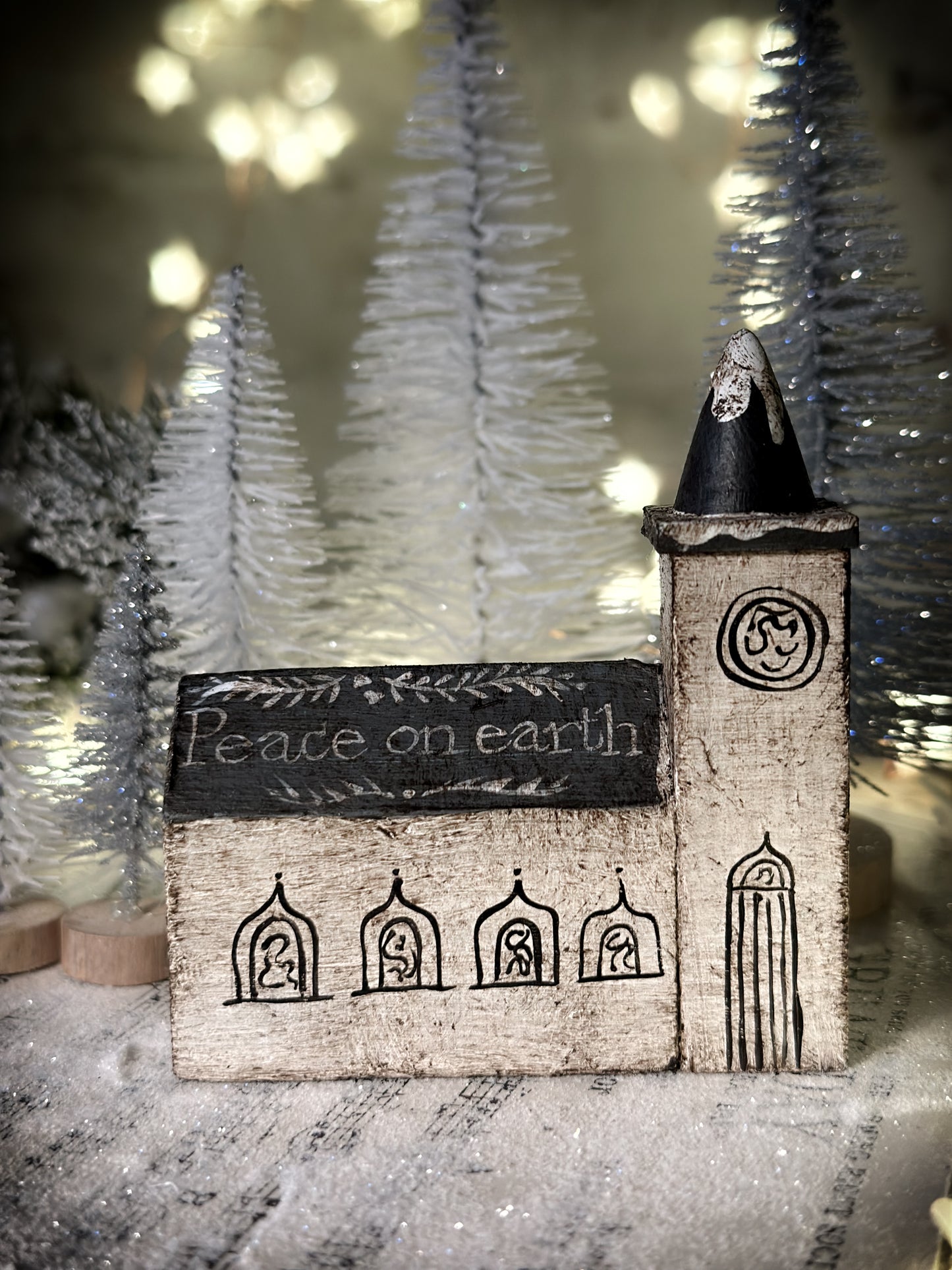A pretty vintage German Erzgebirge Putz wooden village house painted with a Christmas quote