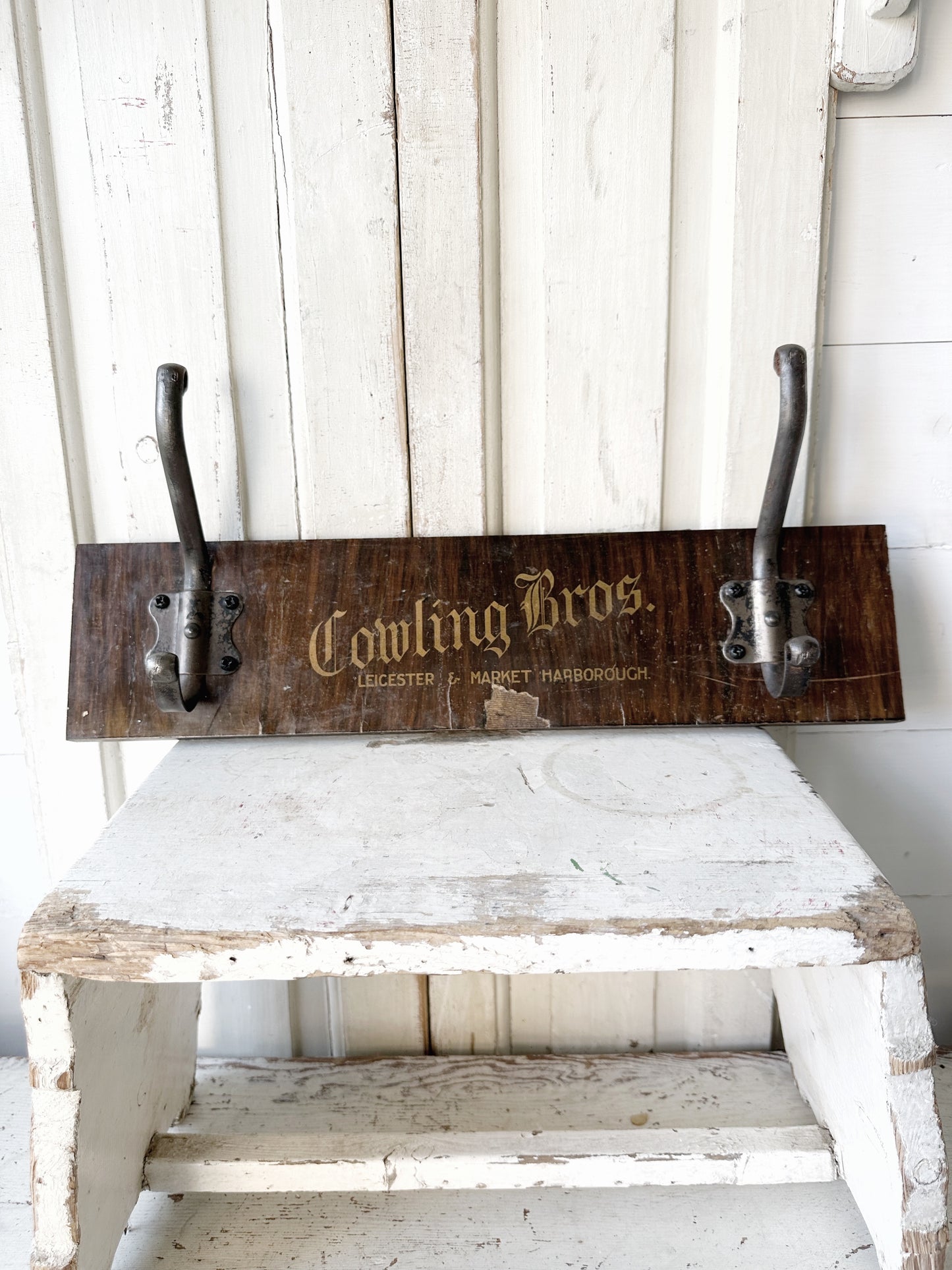 Salvaged sign written drawer front coat pegs