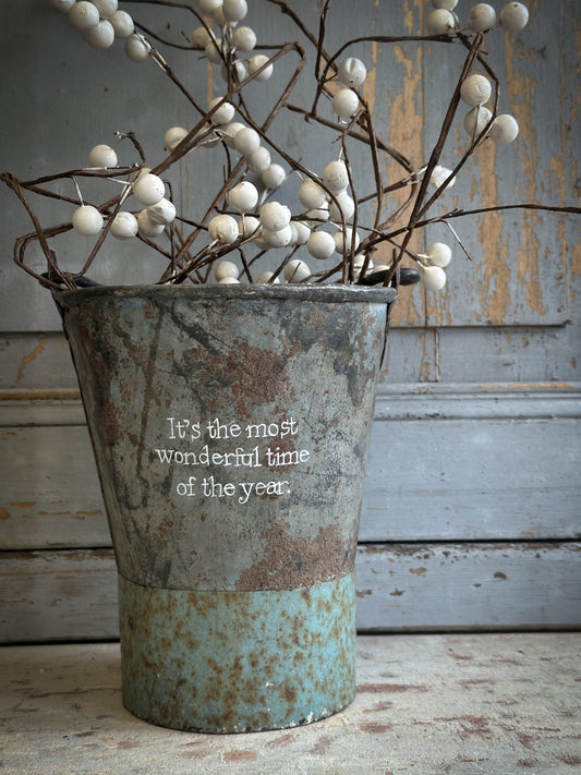 A Recycled Metal Mini Christmas Tree Bucket With A Hand Painted Quote