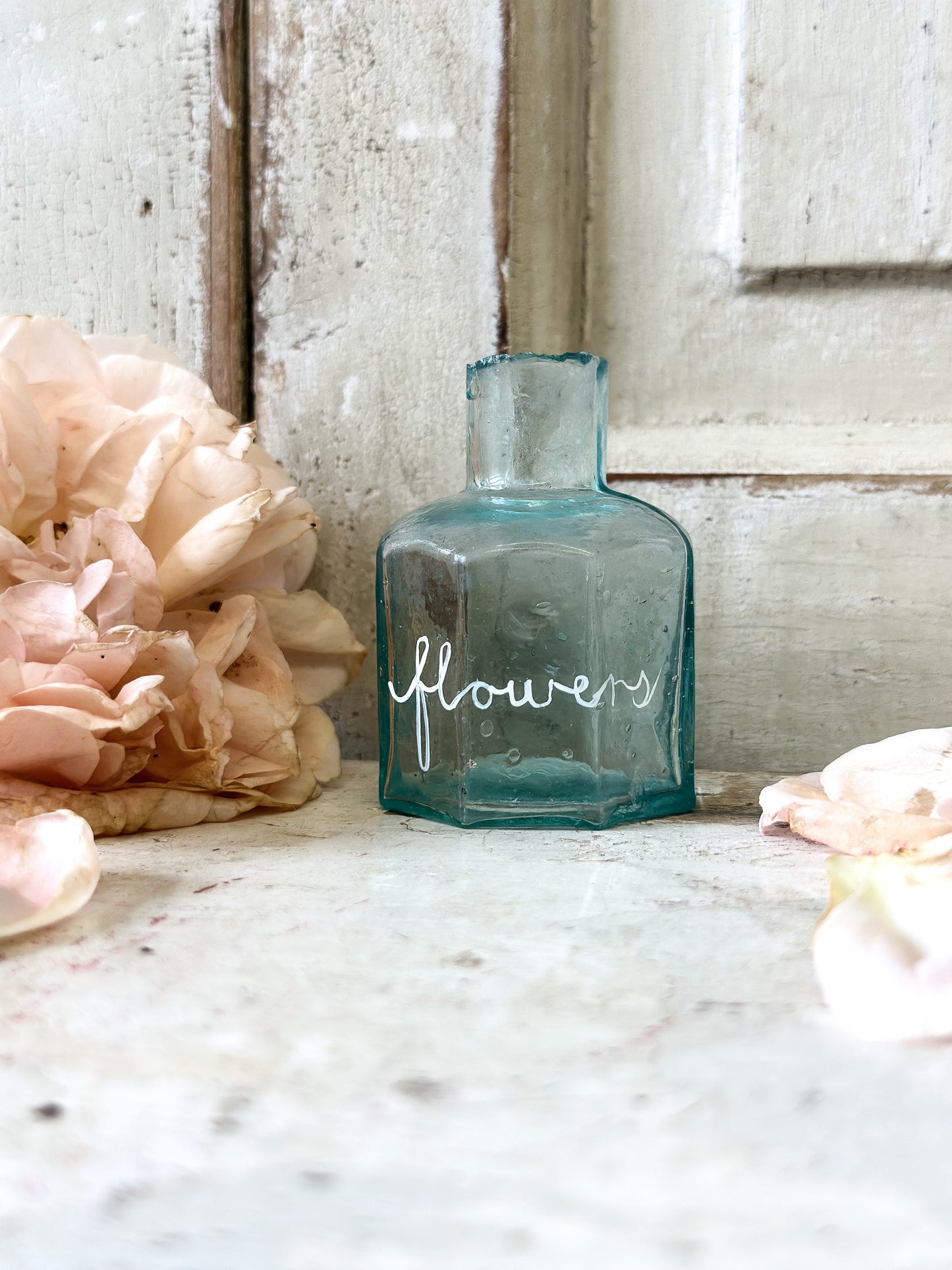A beautiful Victorian bottle with a hand painted quote