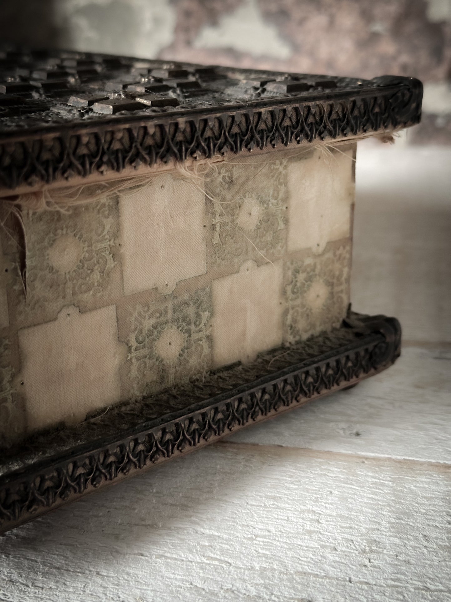 A curious, magical mystery box with medieval beaten metal lid and velvet trim