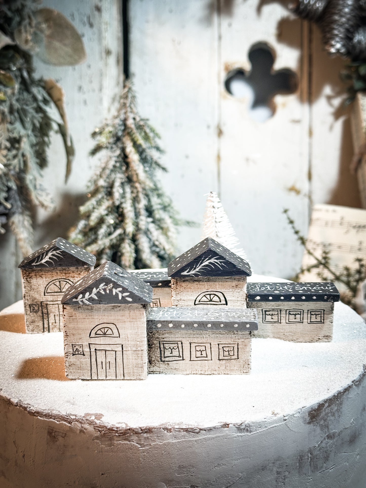 A pretty vintage German Erzgebirge Putz wooden village house painted with a Christmas quote