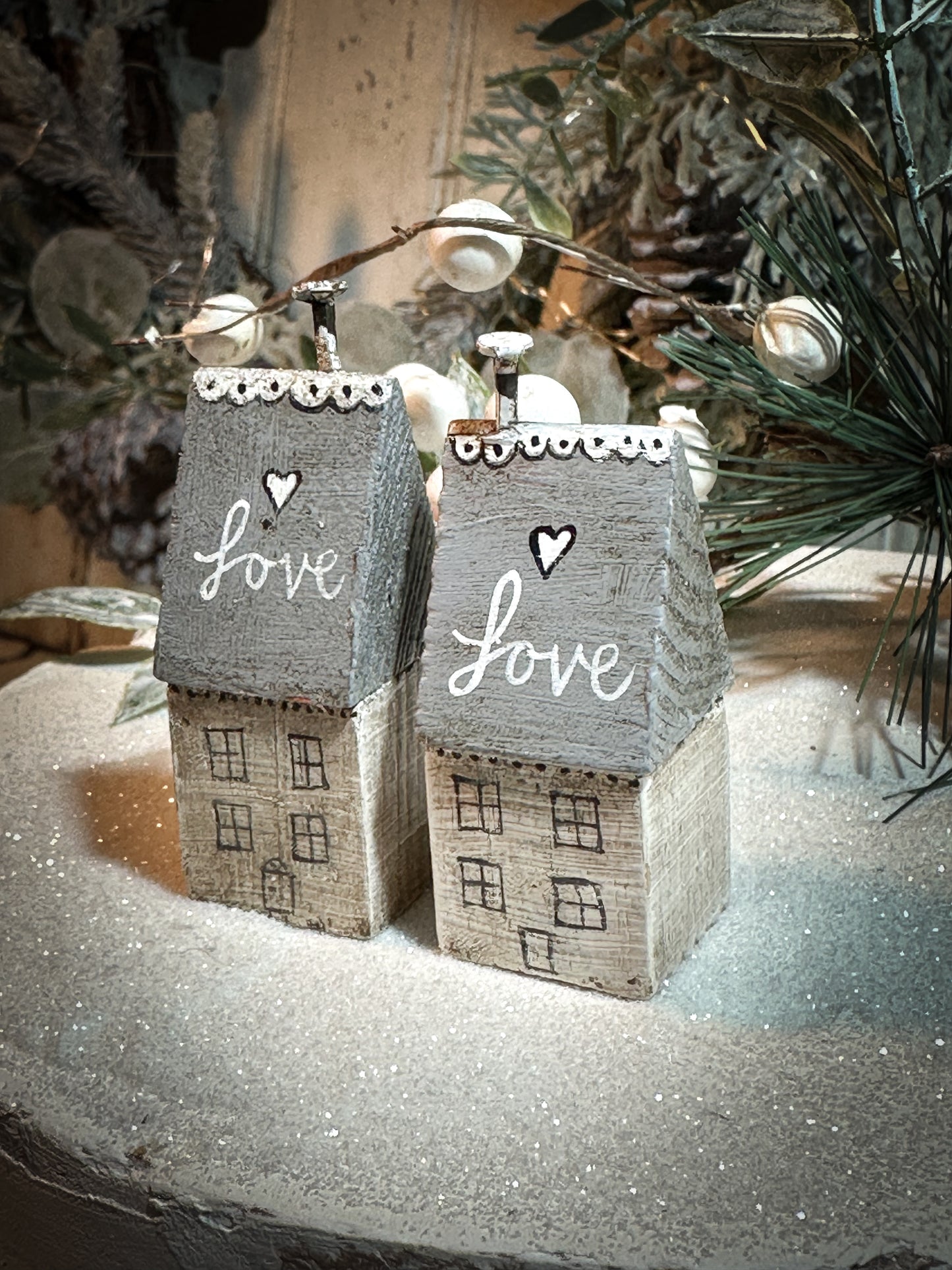 A pretty vintage German Erzgebirge Putz wooden village house painted with a Christmas quote