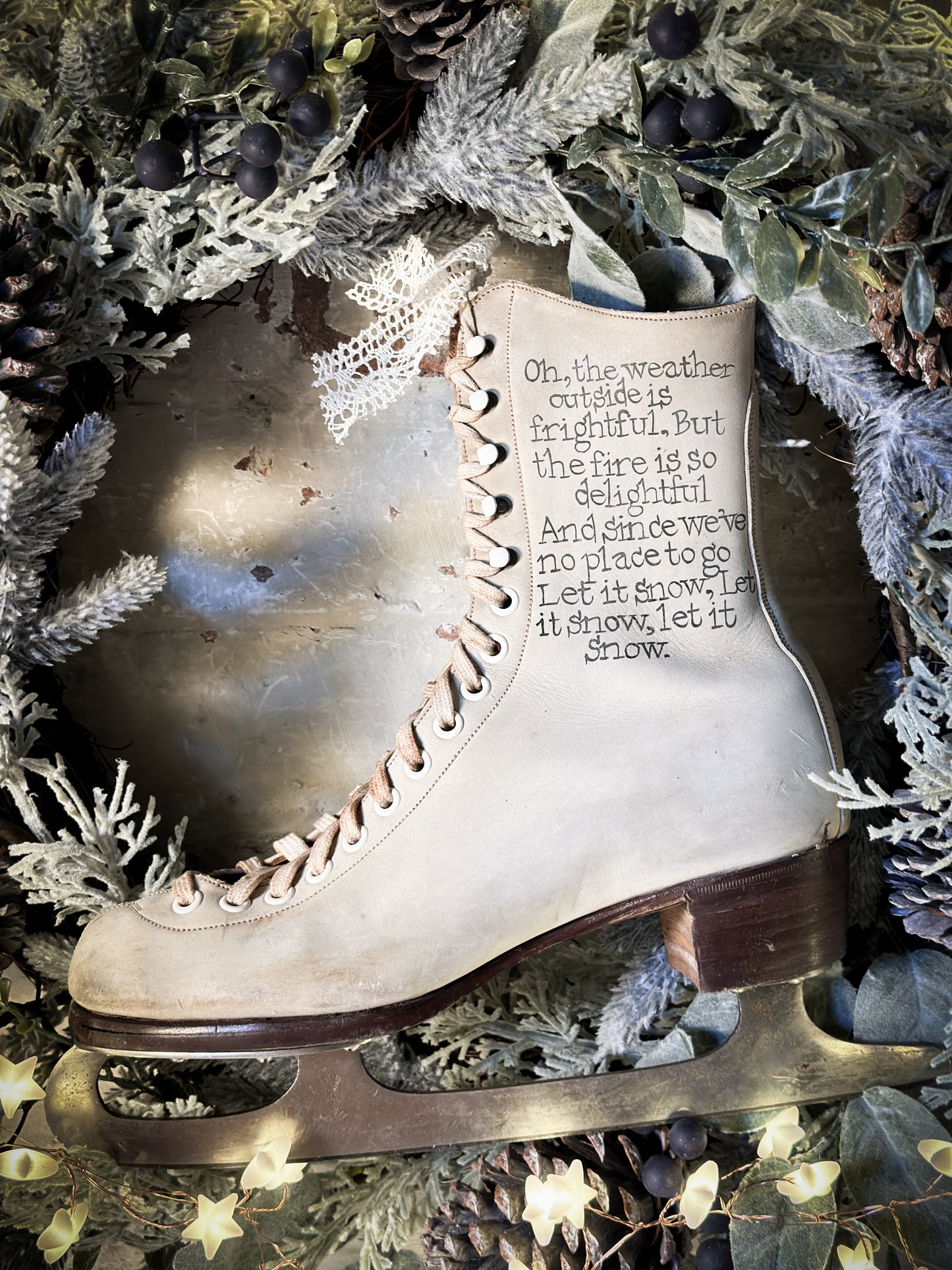 A beautiful vintage Christmas ice skate hand painted using traditional sign writer’s techniques and materials