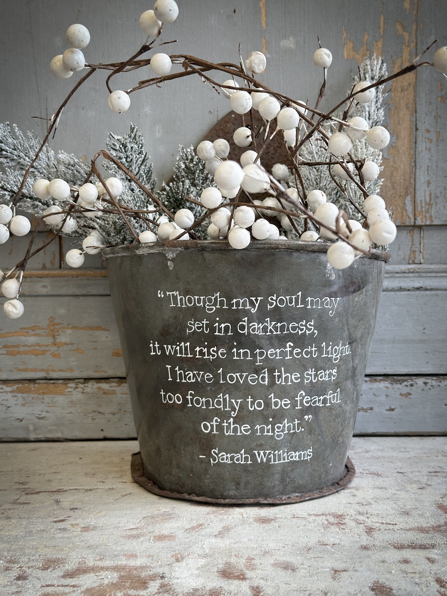 A Recycled Metal Candle Store With A Hand Painted Quote