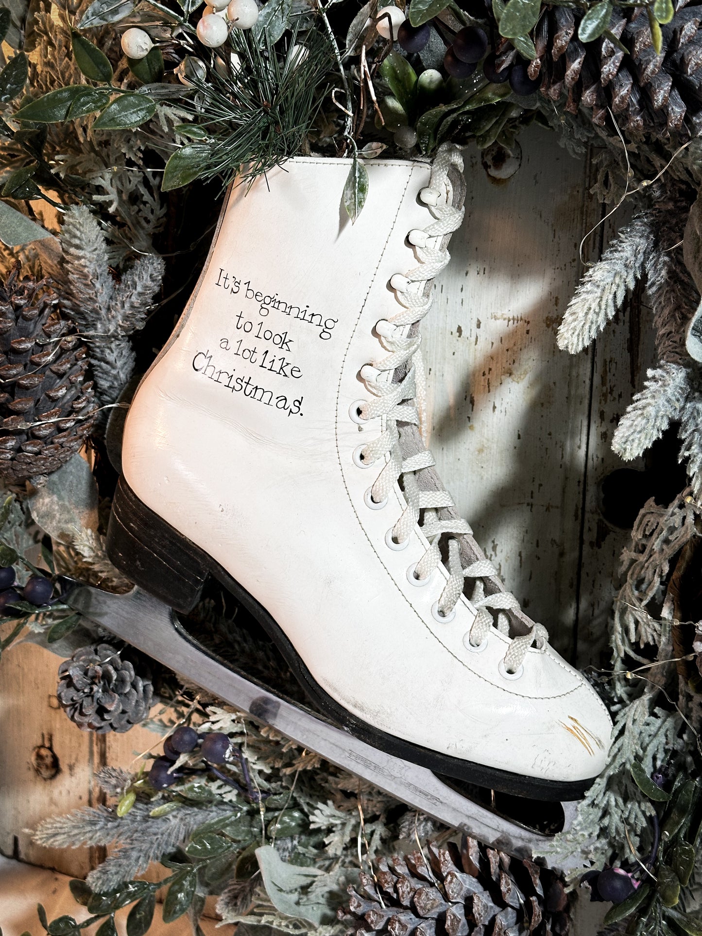 A beautiful vintage Christmas ice skate hand painted using traditional sign writer’s techniques and materials
