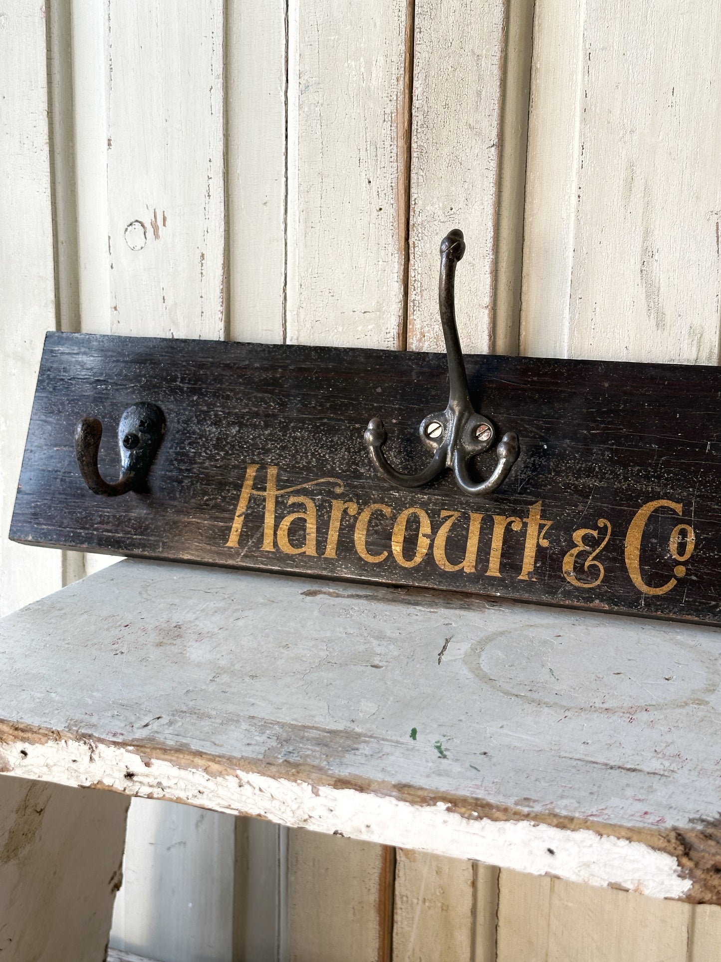 Salvaged sign written drawer front coat pegs