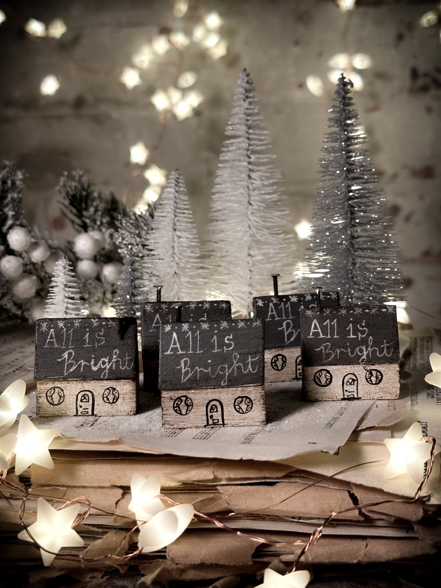 A pretty vintage German Erzgebirge Putz wooden village house painted with a Christmas quote