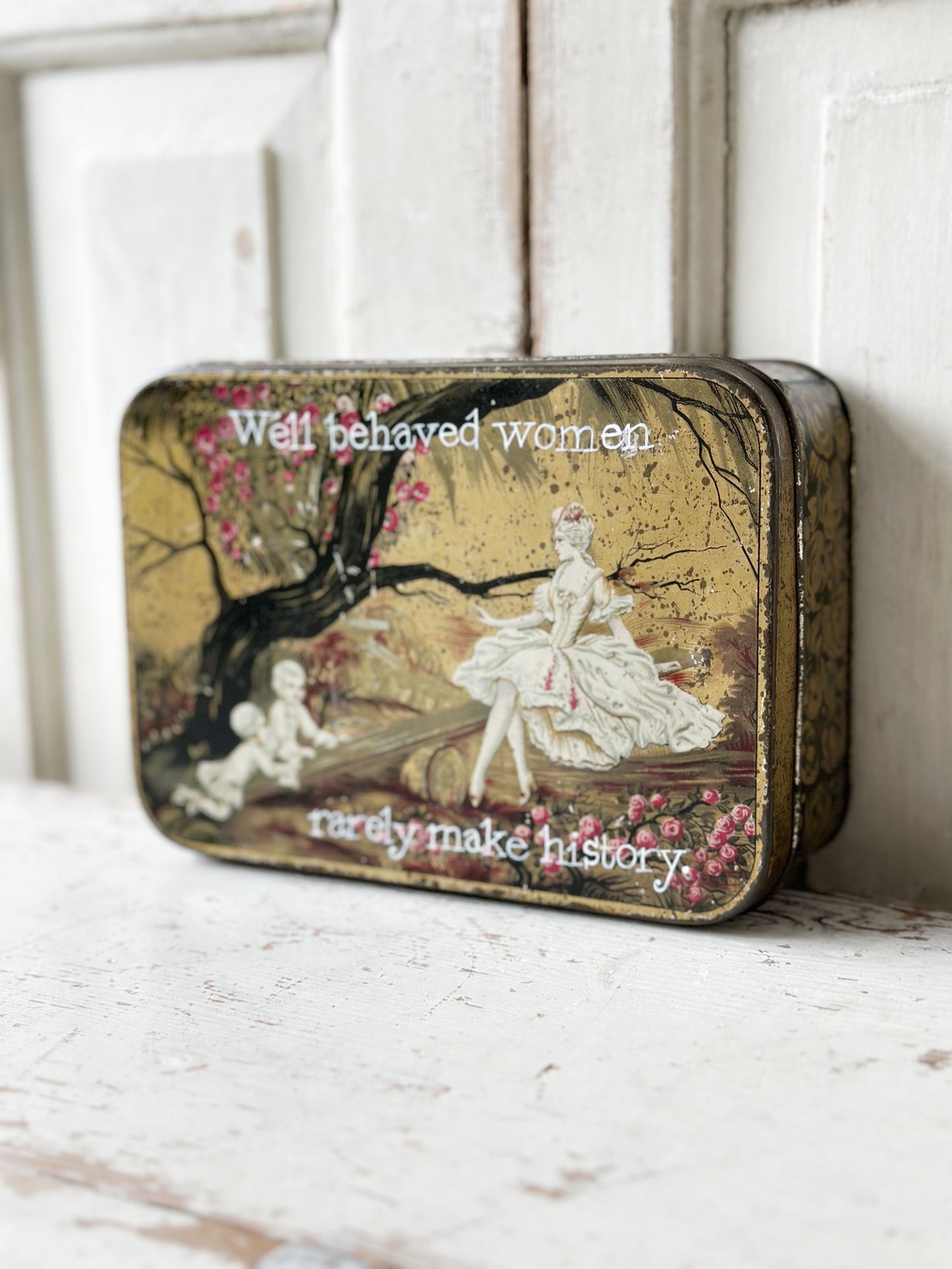 A pretty antique tin with a hand painted quote.