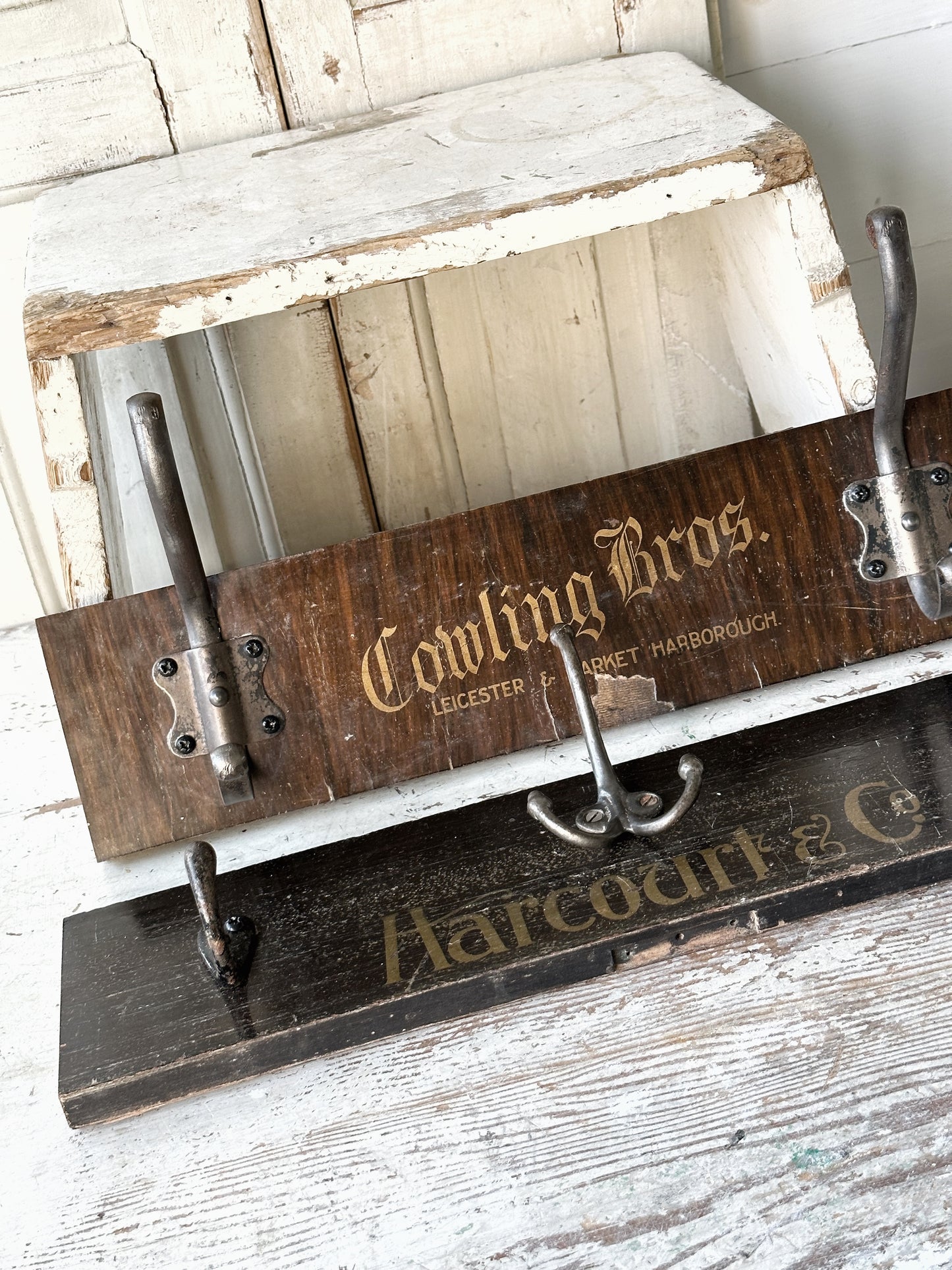 Salvaged sign written drawer front coat pegs