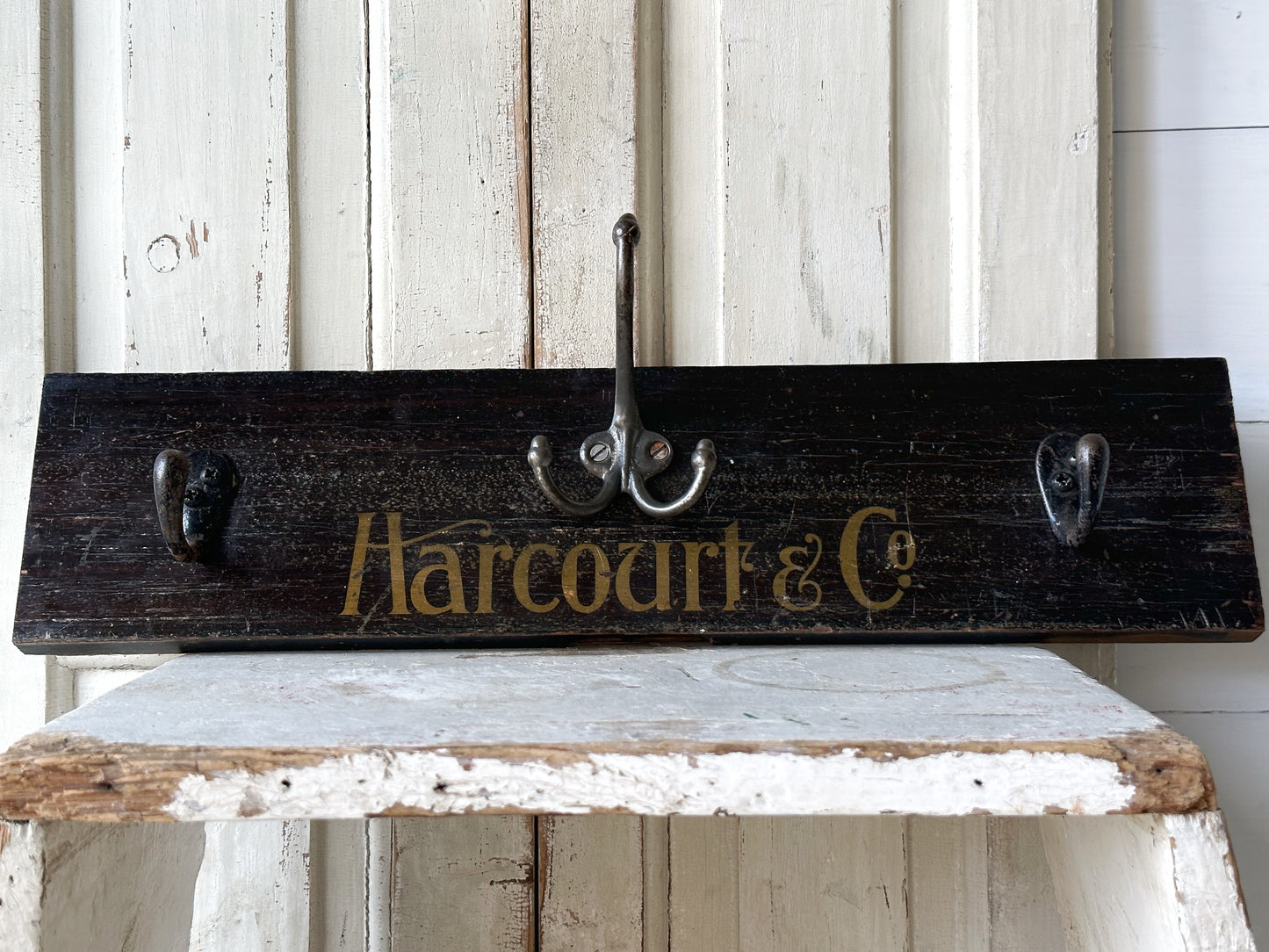 Salvaged sign written drawer front coat pegs