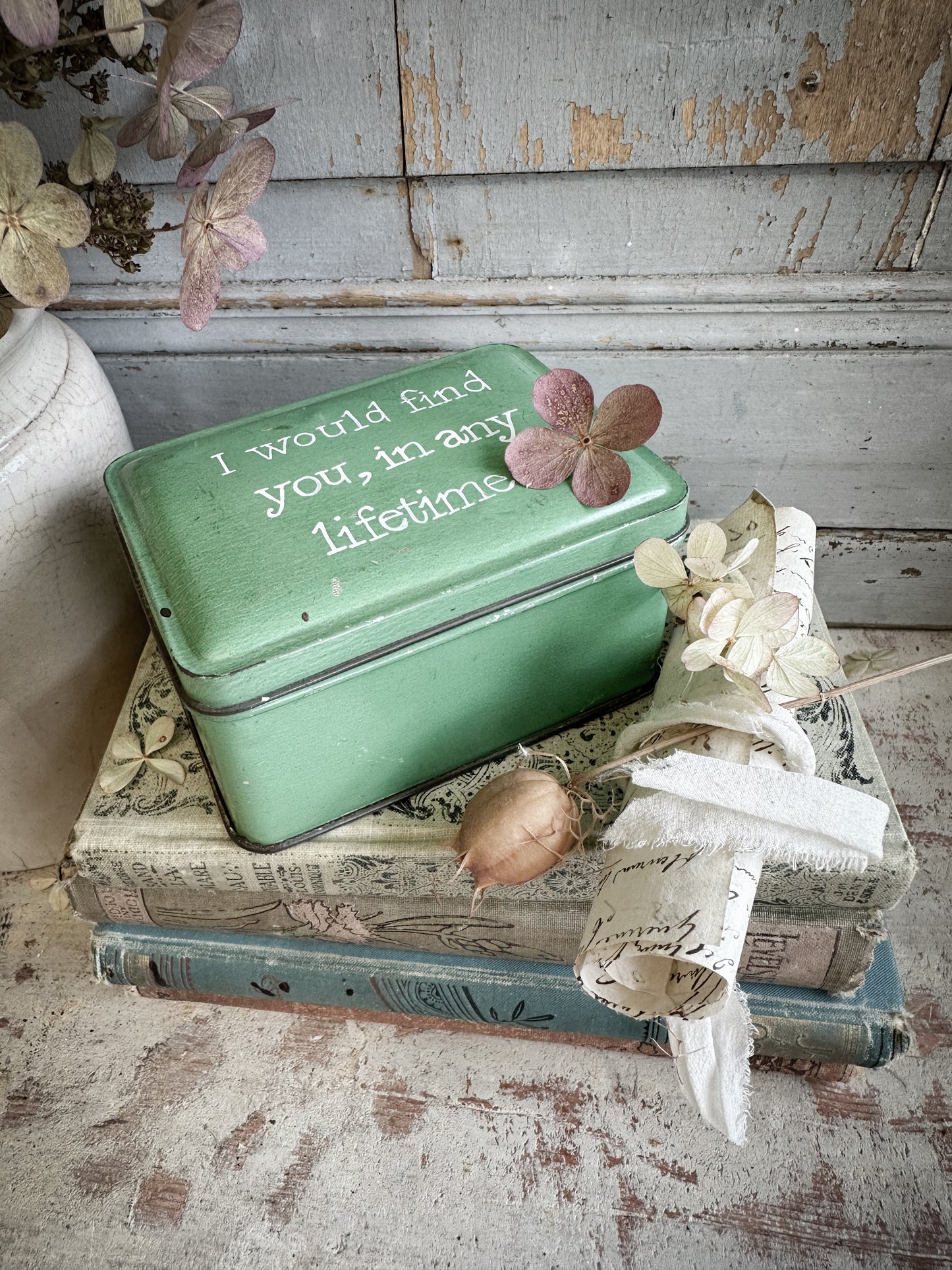 A Vintage Tin With A Hand Painted Quote