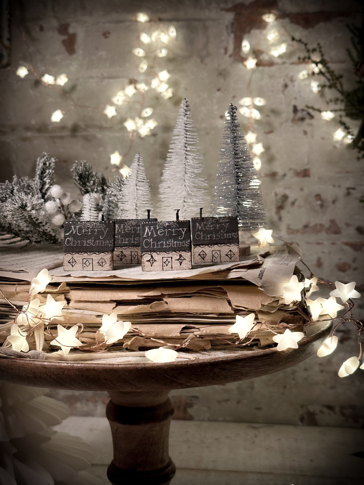 A pretty vintage German Erzgebirge Putz wooden village house painted with a Christmas quote