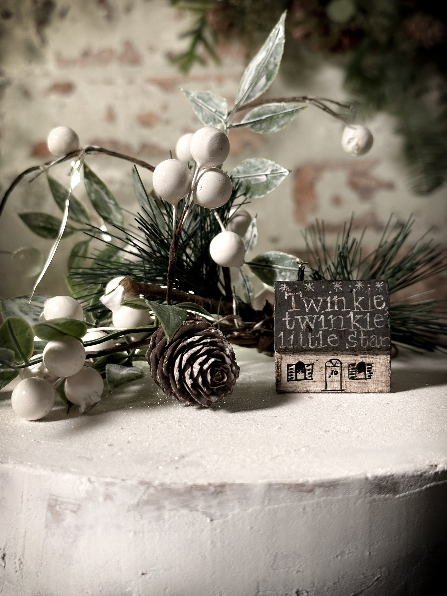 A pretty vintage German Erzgebirge Putz wooden village house painted with a Christmas quote