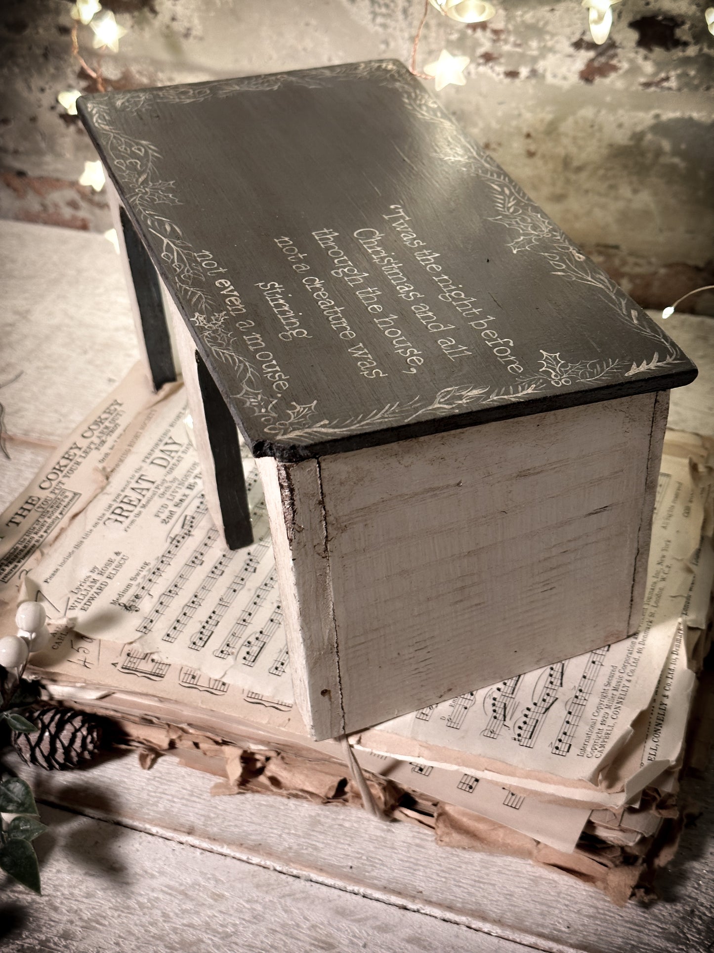 A hand painted quote on a vintage scratch built folk art model farm barn