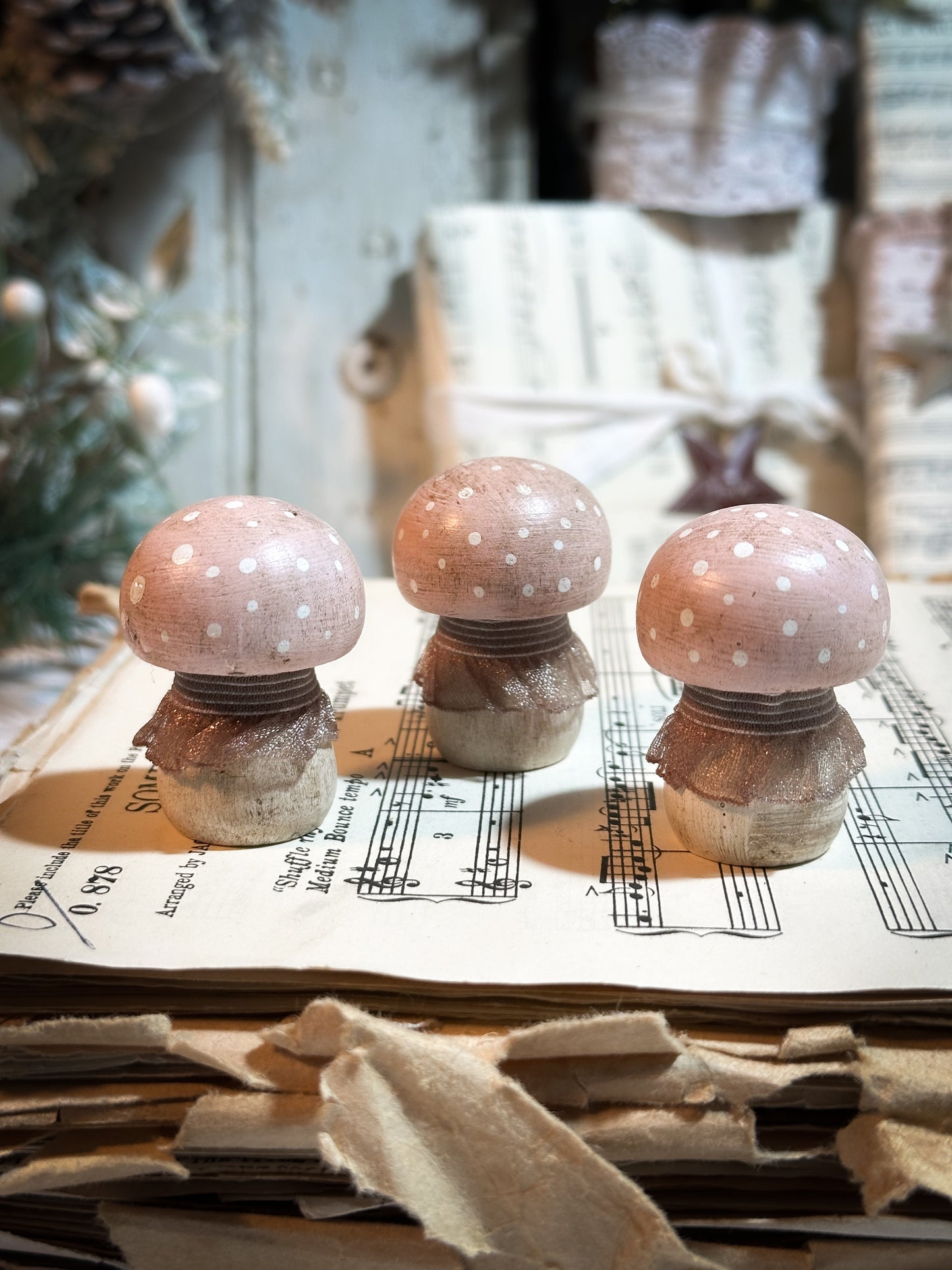 A wooden hand painted and trimmed Christmas village toadstool