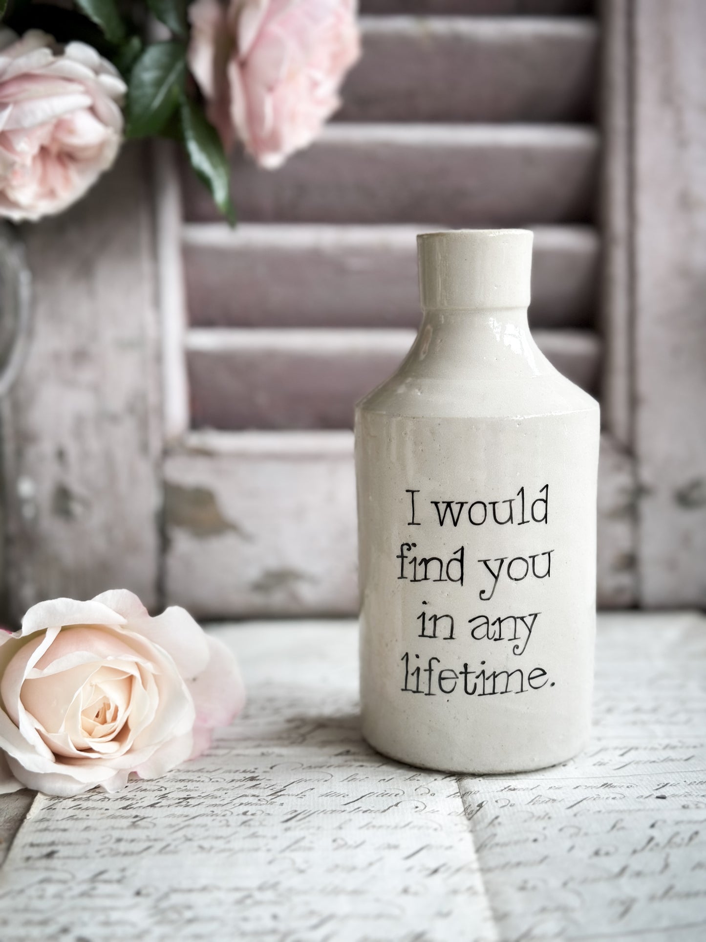 A Victorian unearthed stoneware pottery bottle with a hand painted quote