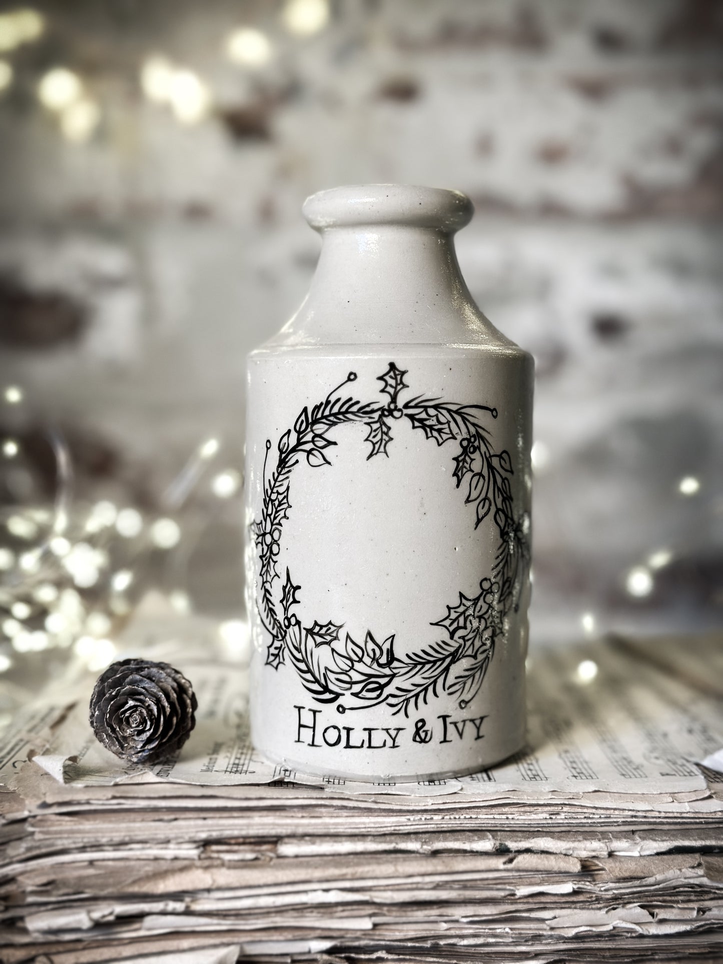 A hand painted and illustrated vintage Victorian bottle
