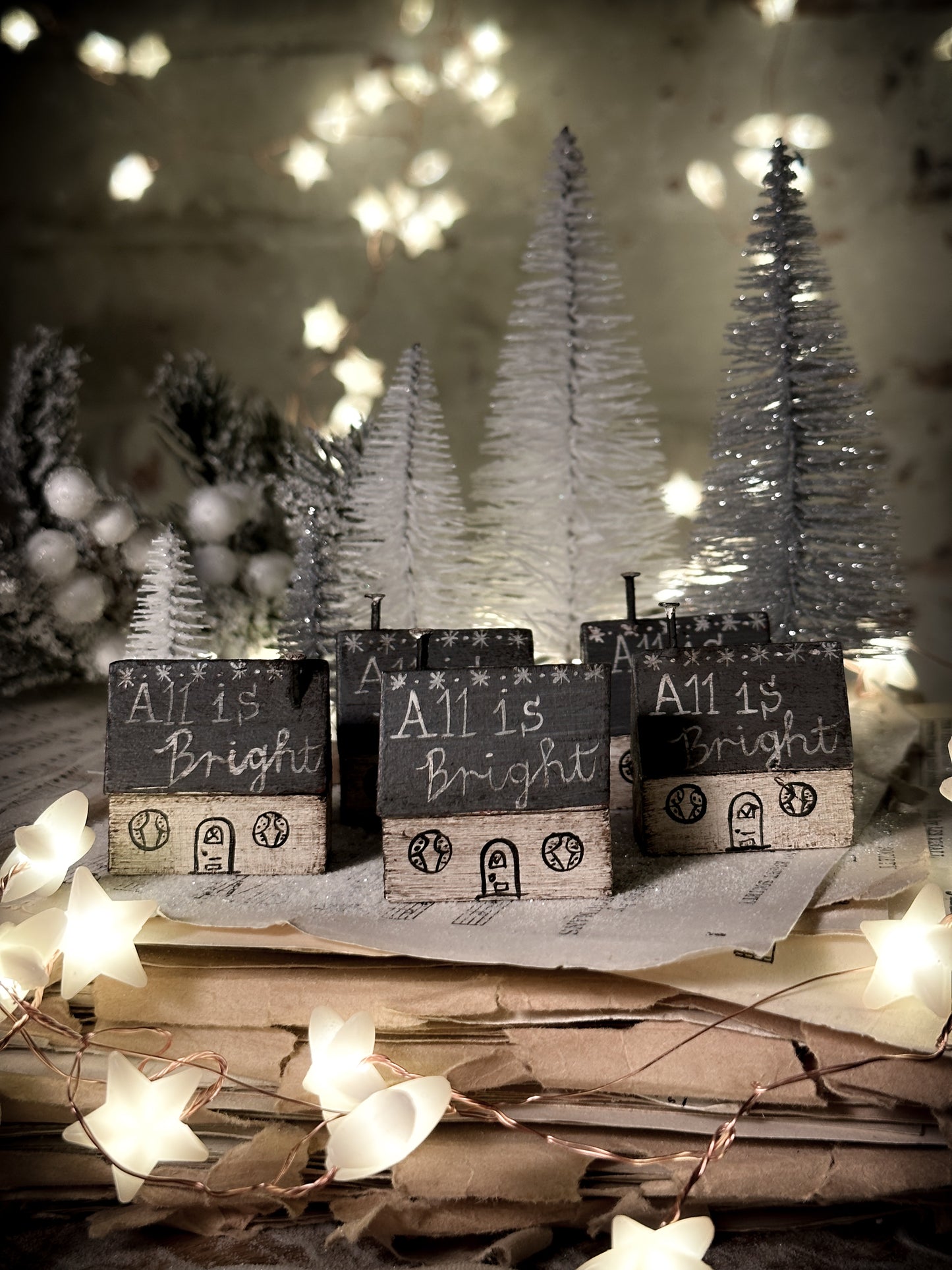 A pretty vintage German Erzgebirge Putz wooden village house painted with a Christmas quote