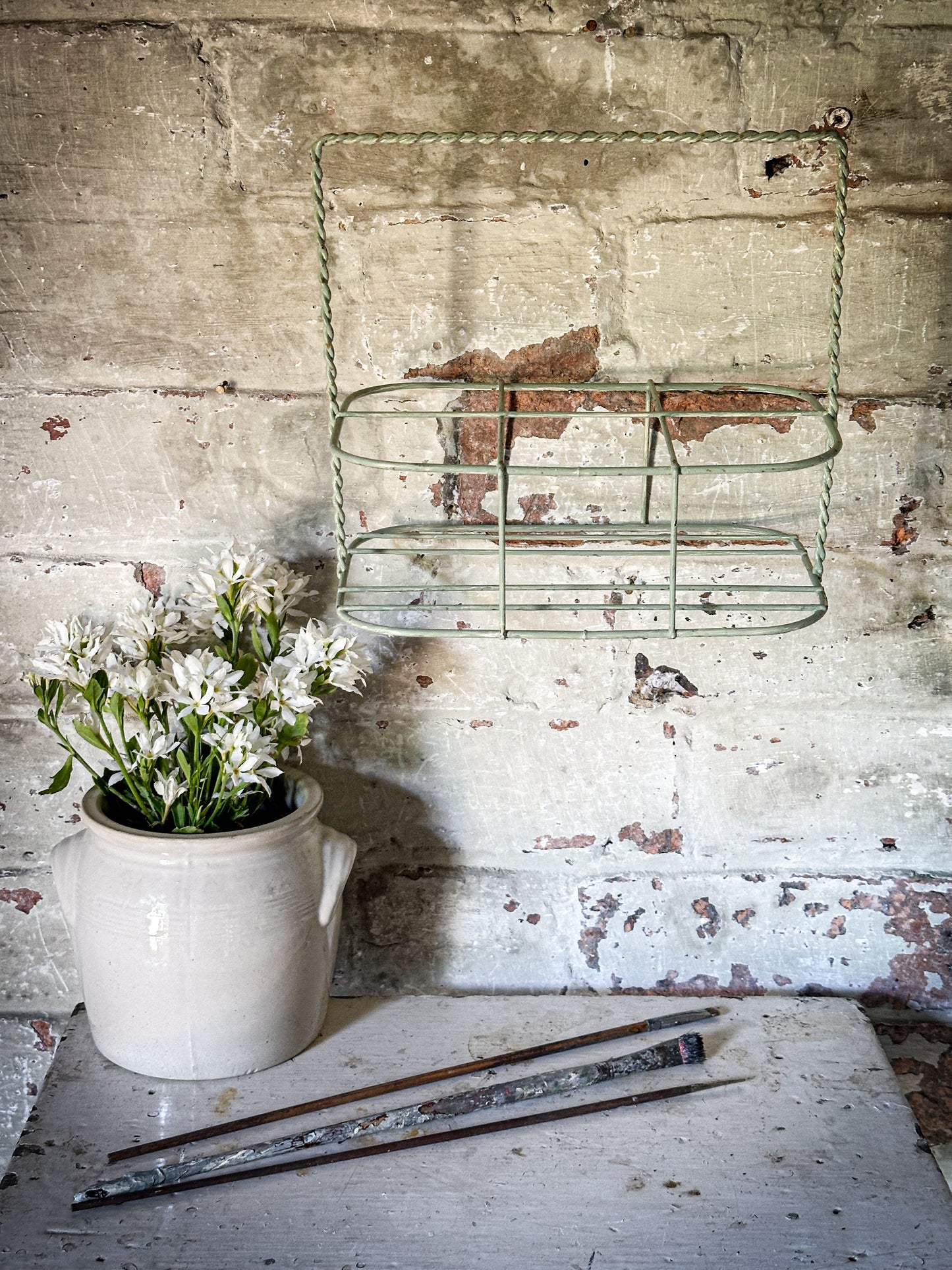 A Vintage French Wire Bottle Rack