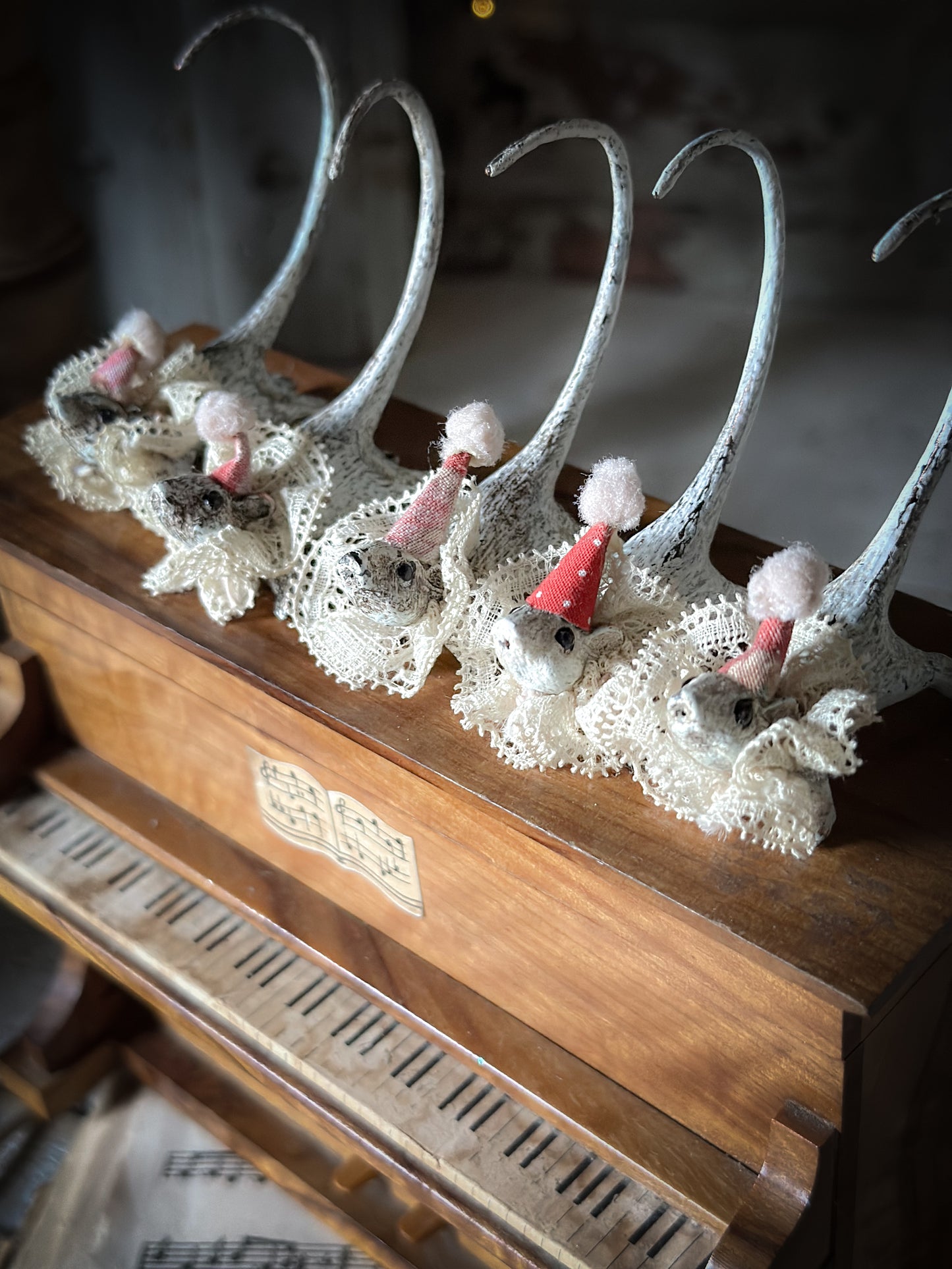 A cold painted brass “night before Christmas mouse” with a lace ruffle and Christmas hat