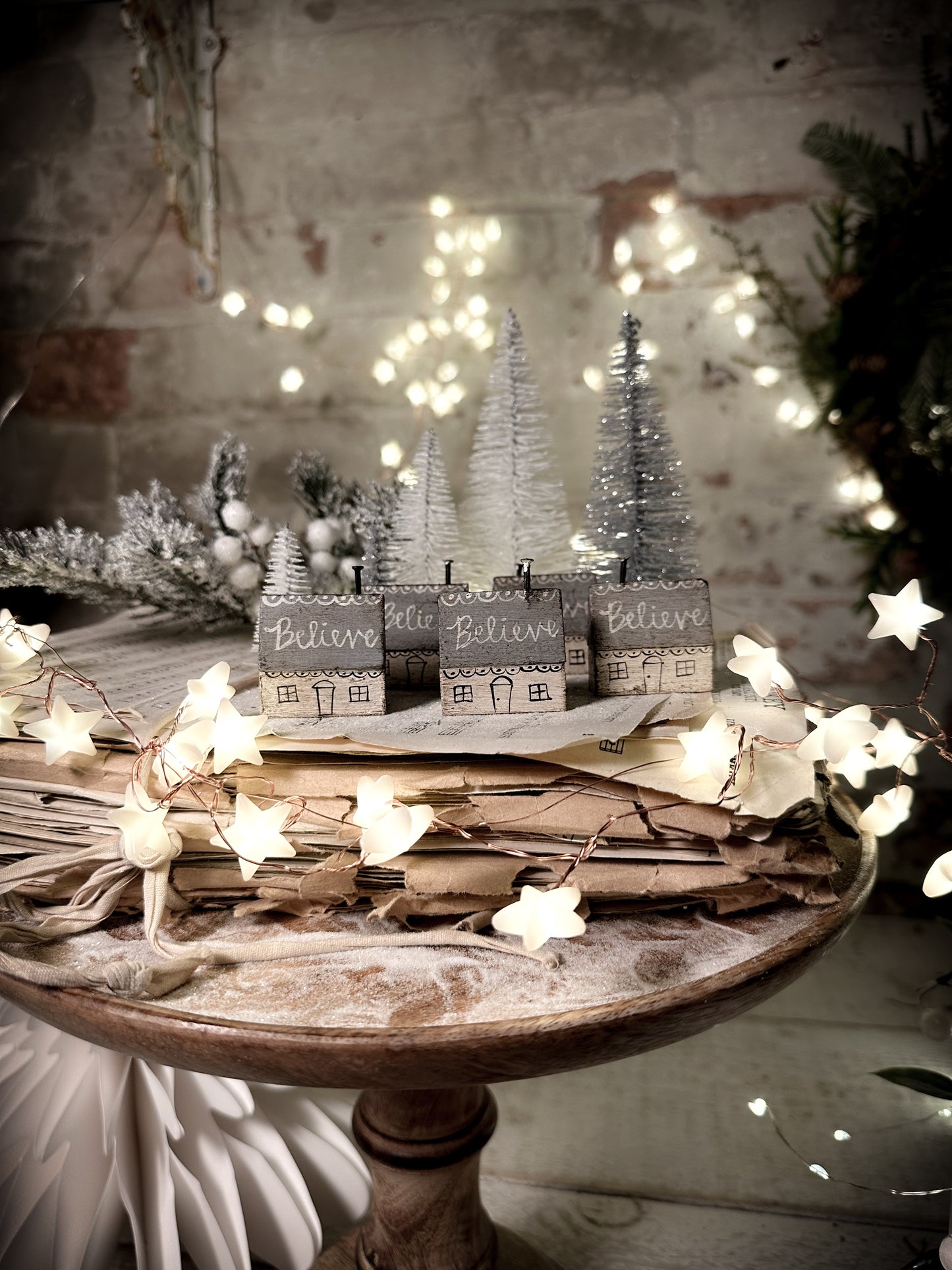 A pretty vintage German Erzgebirge Putz wooden village house painted with a Christmas quote