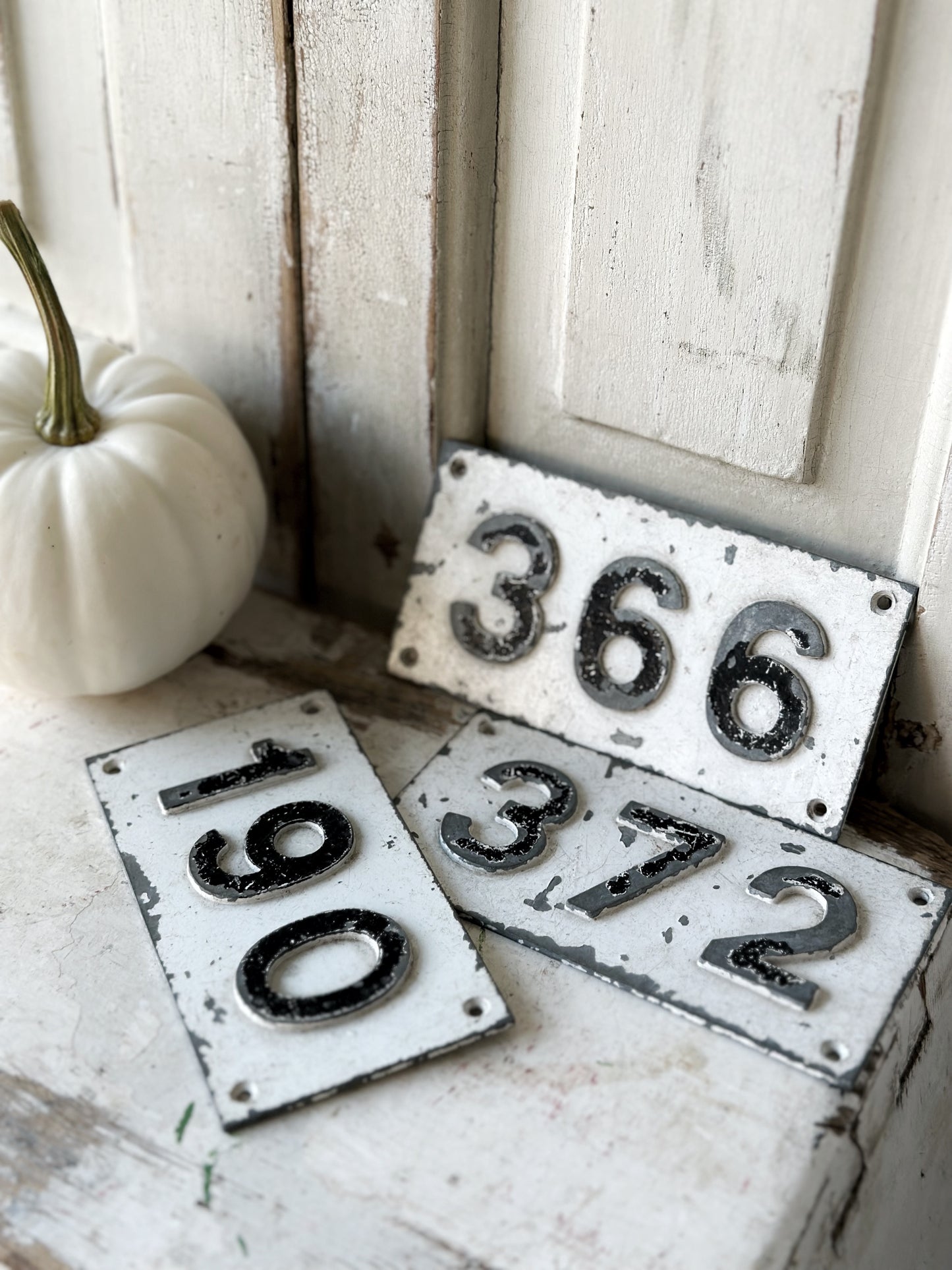 Three vintage French cast iron signs locker numbers