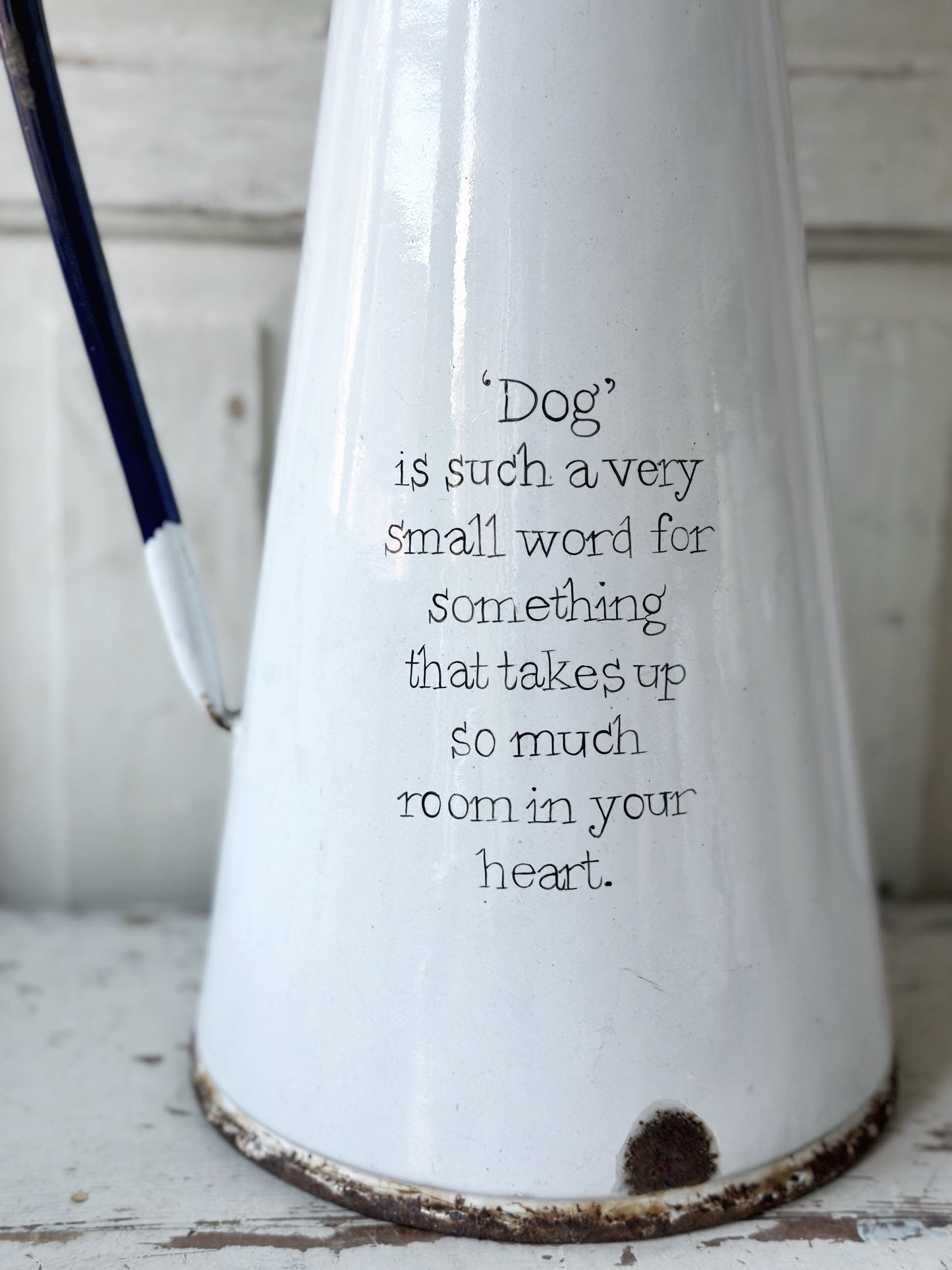 A hand painted quote on a beautiful Vintage white enamelware jug