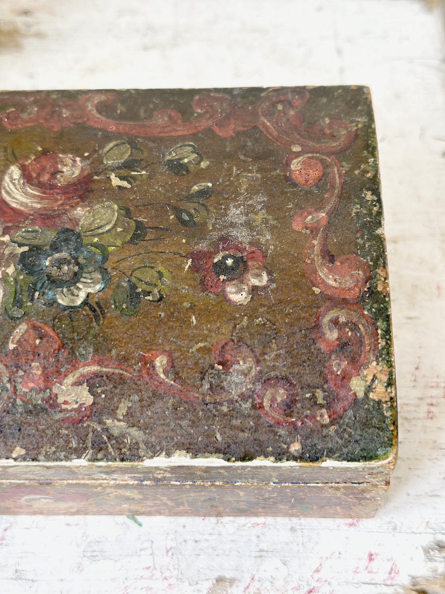 A beautiful antique painted box with floral detail