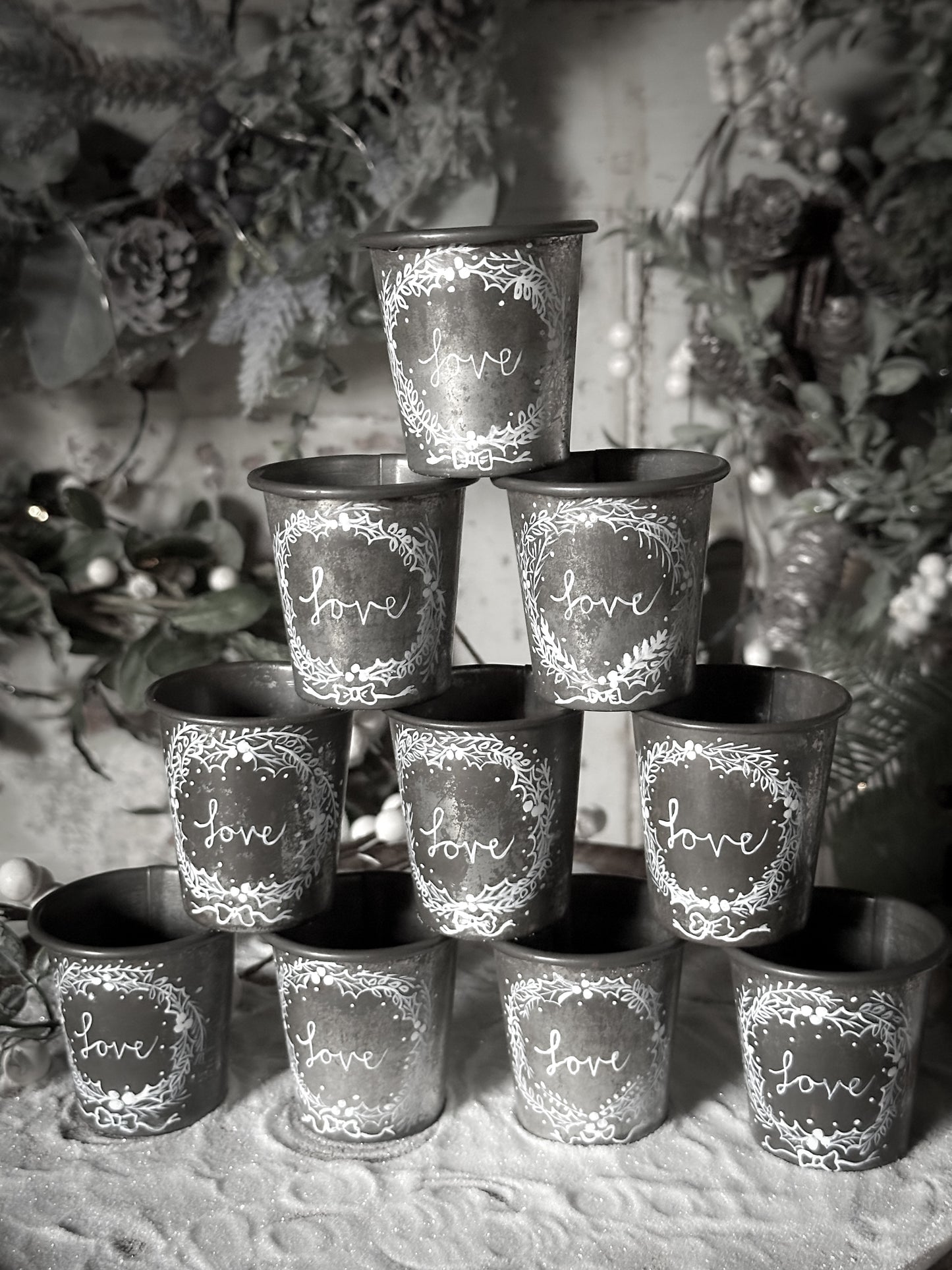 A pretty hand painted Dariole tin tea light holder