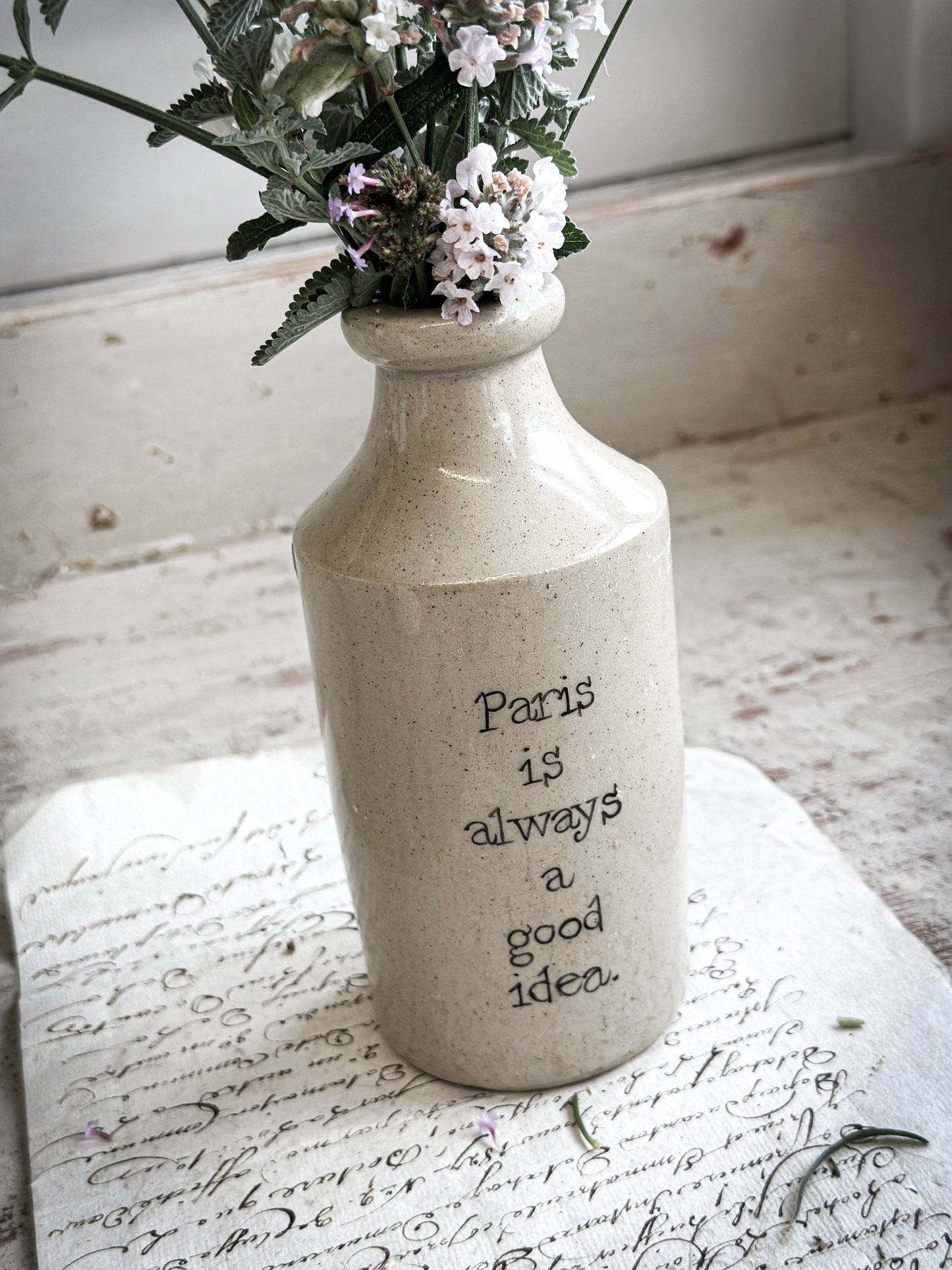A Victorian unearthed short stoneware pottery bottle with a hand painted quote