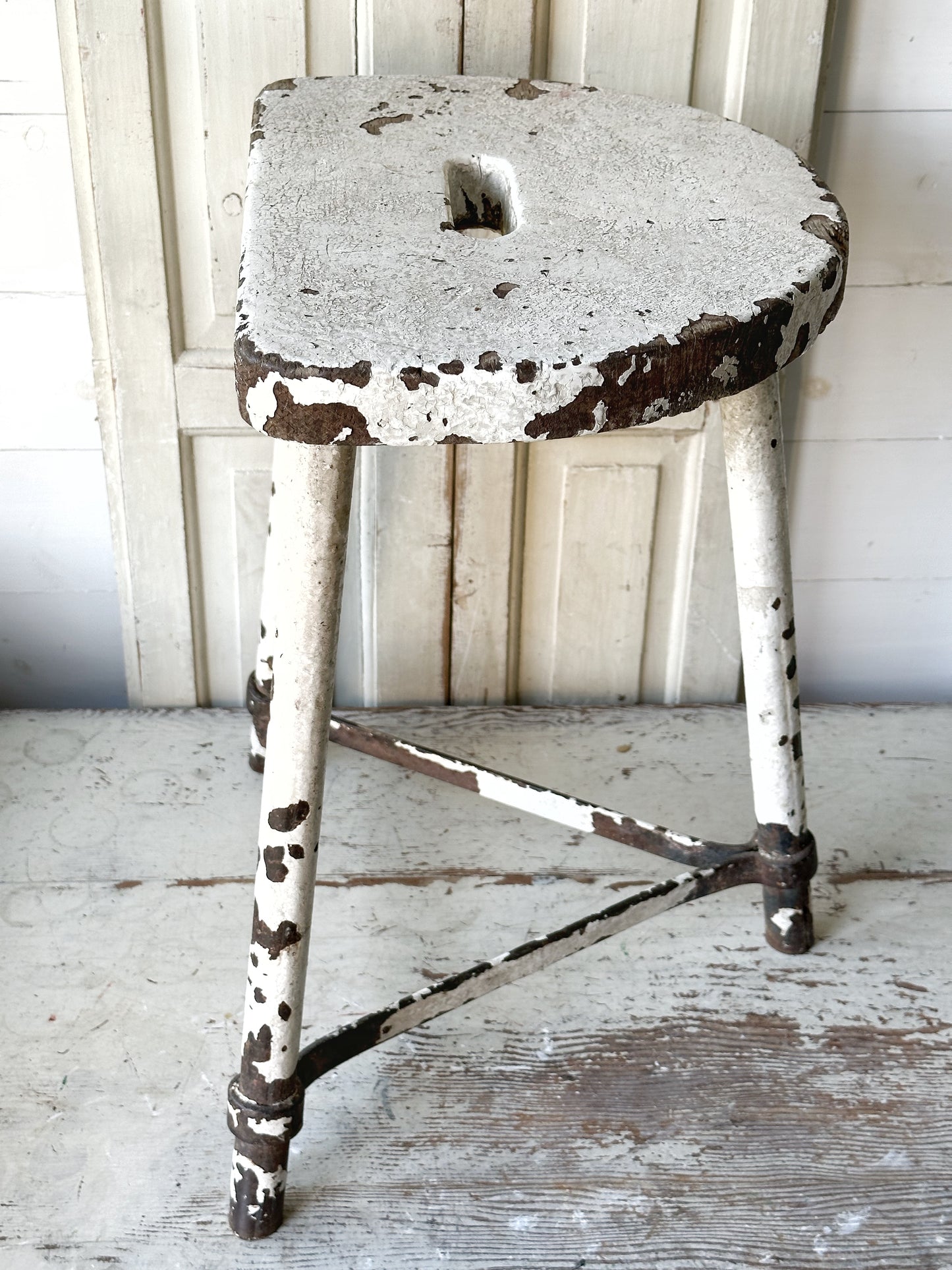 A chippy white French engineer’s stool 1930’s