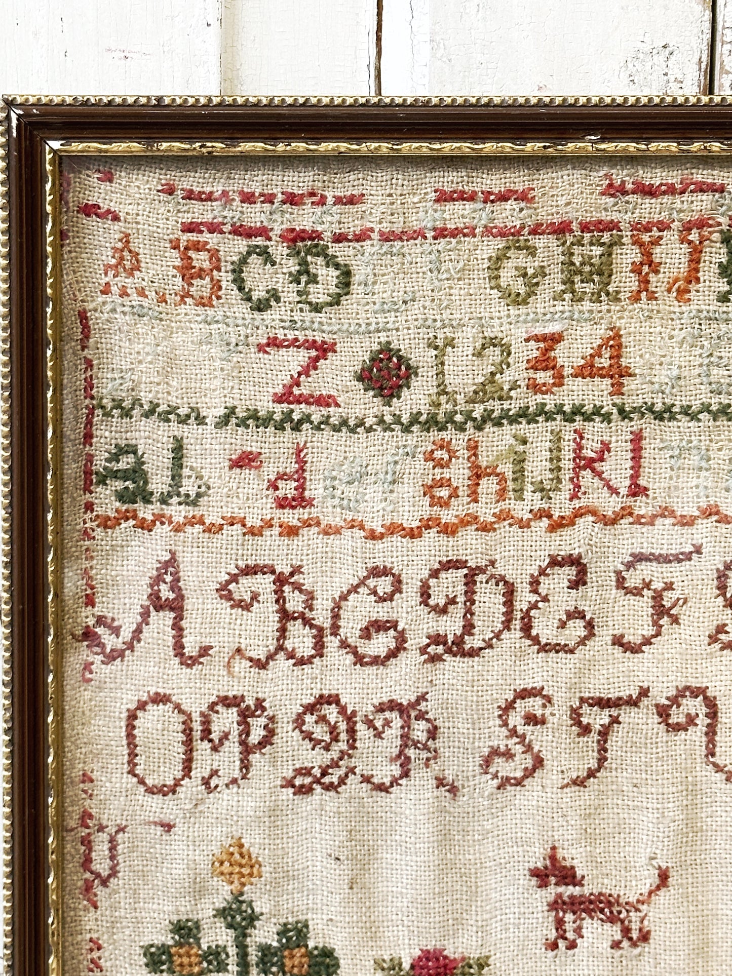 A beautiful 19th century colourful antique needlework sampler