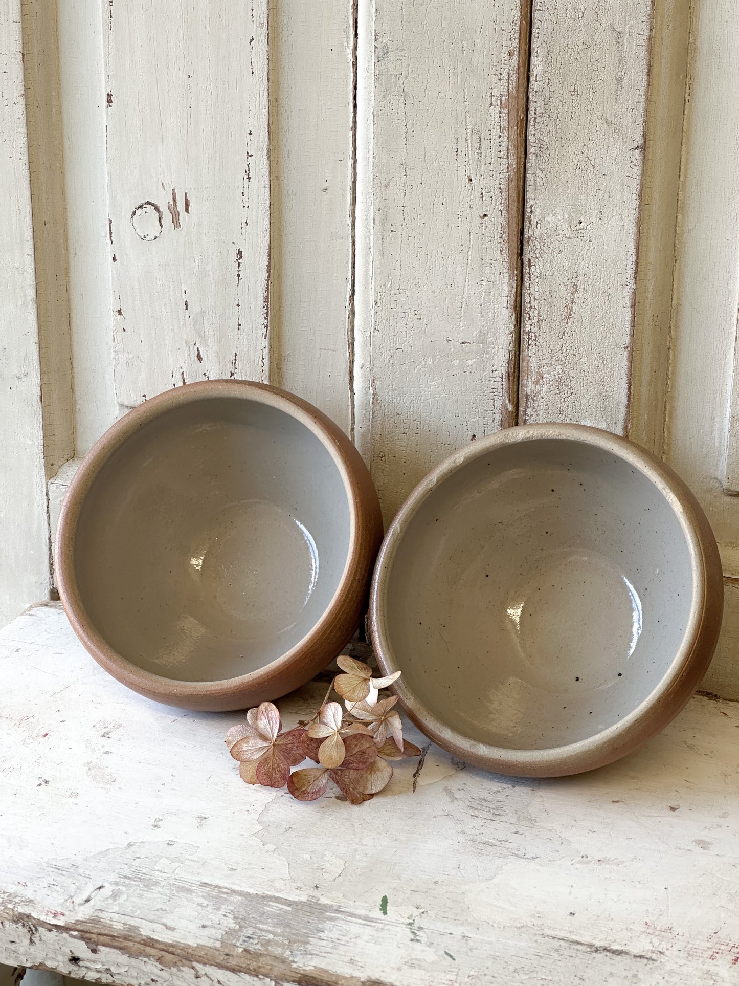 A pair of rustic antique French stoneware bowls