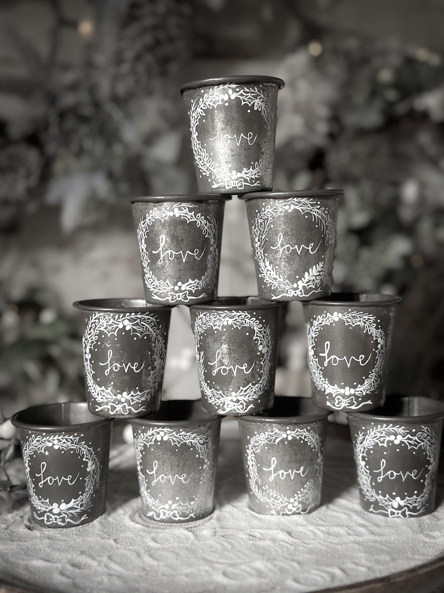 A pretty hand painted Dariole tin tea light holder