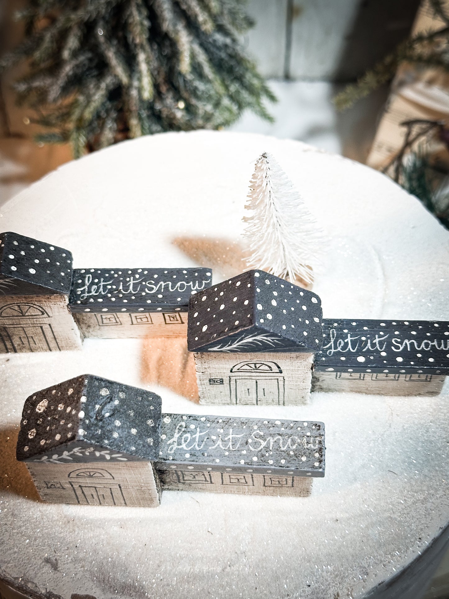 A pretty vintage German Erzgebirge Putz wooden village house painted with a Christmas quote
