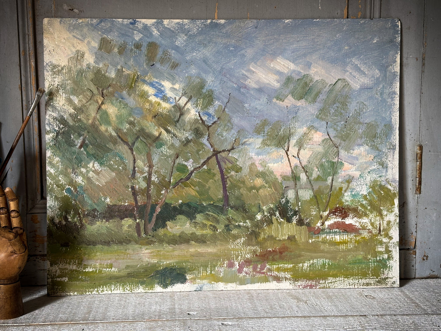An Impressionist styled oil on board painting of a French landscape