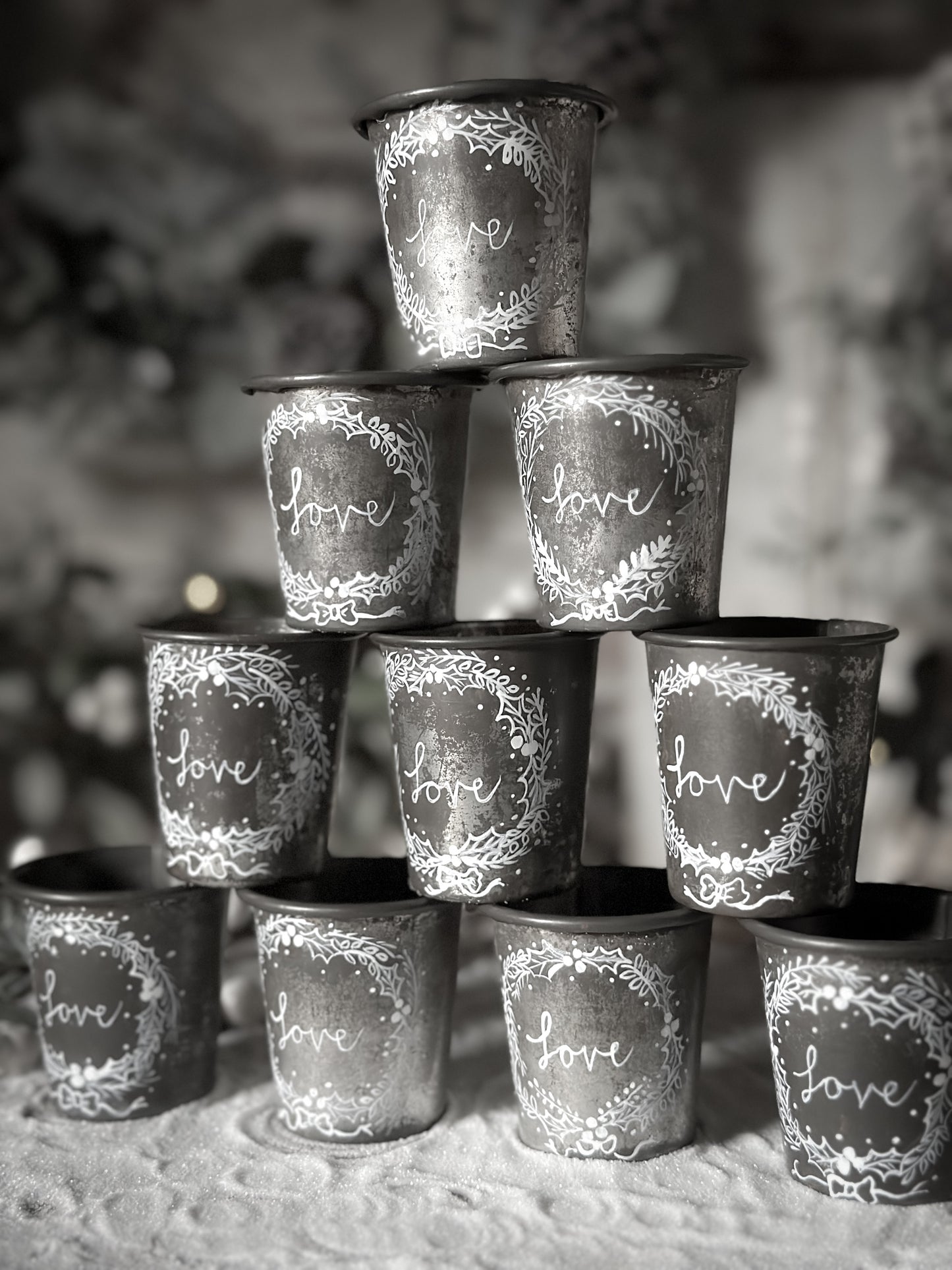 A pretty hand painted Dariole tin tea light holder