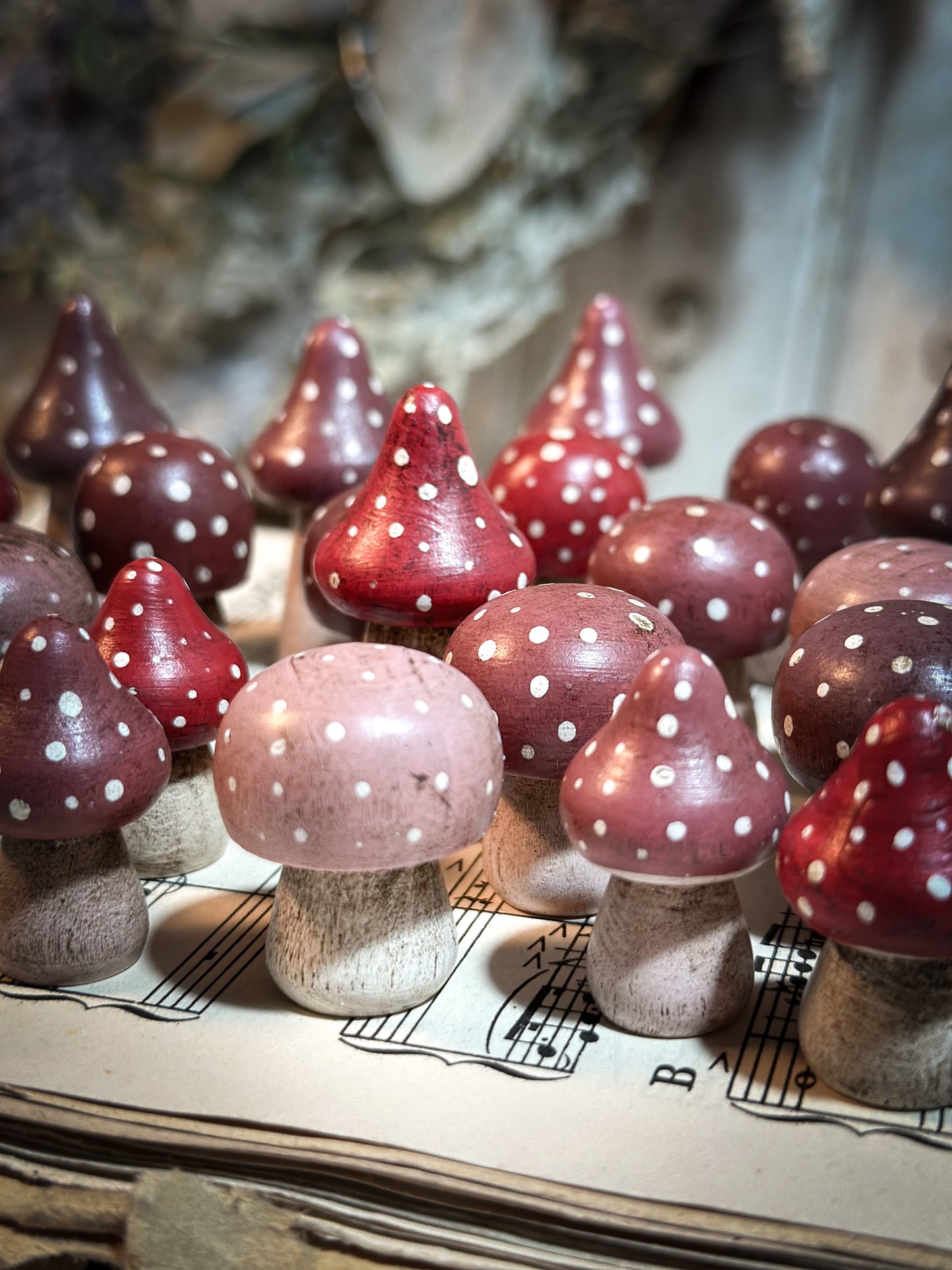 A wooden hand painted Christmas village toadstool