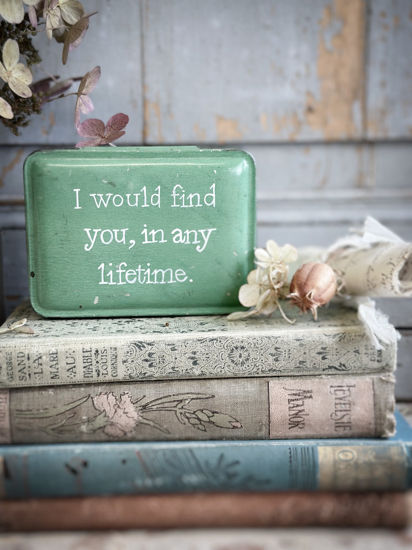 A Vintage Tin With A Hand Painted Quote
