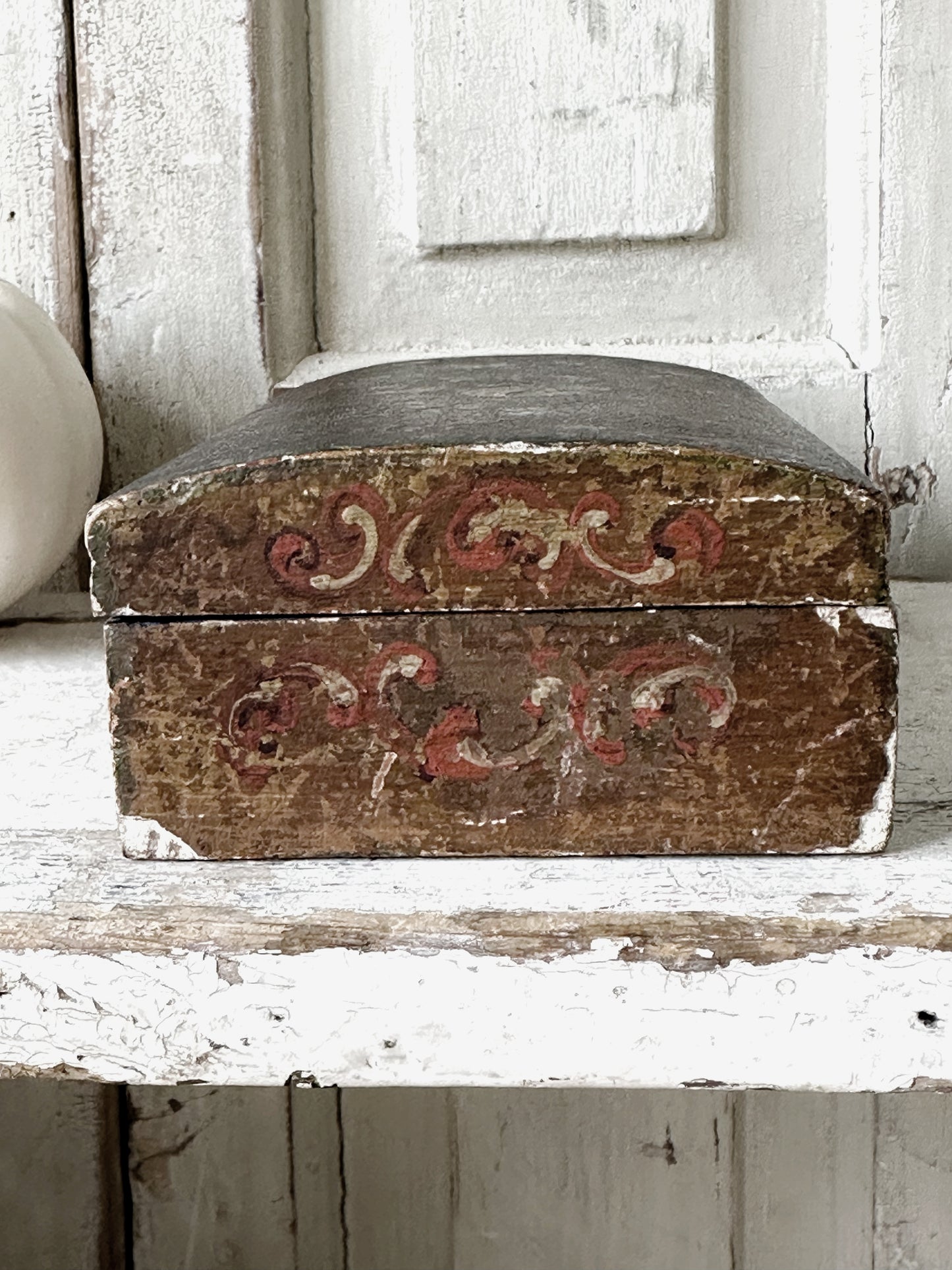 A beautiful antique painted box with floral detail