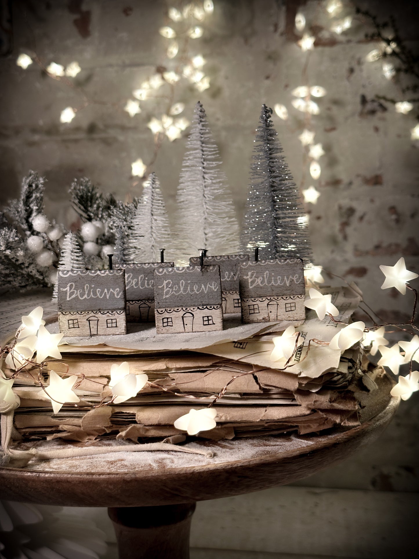A pretty vintage German Erzgebirge Putz wooden village house painted with a Christmas quote
