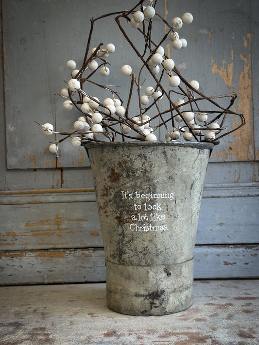 A Recycled Metal Mini Christmas Tree Bucket With A Hand Painted Quote