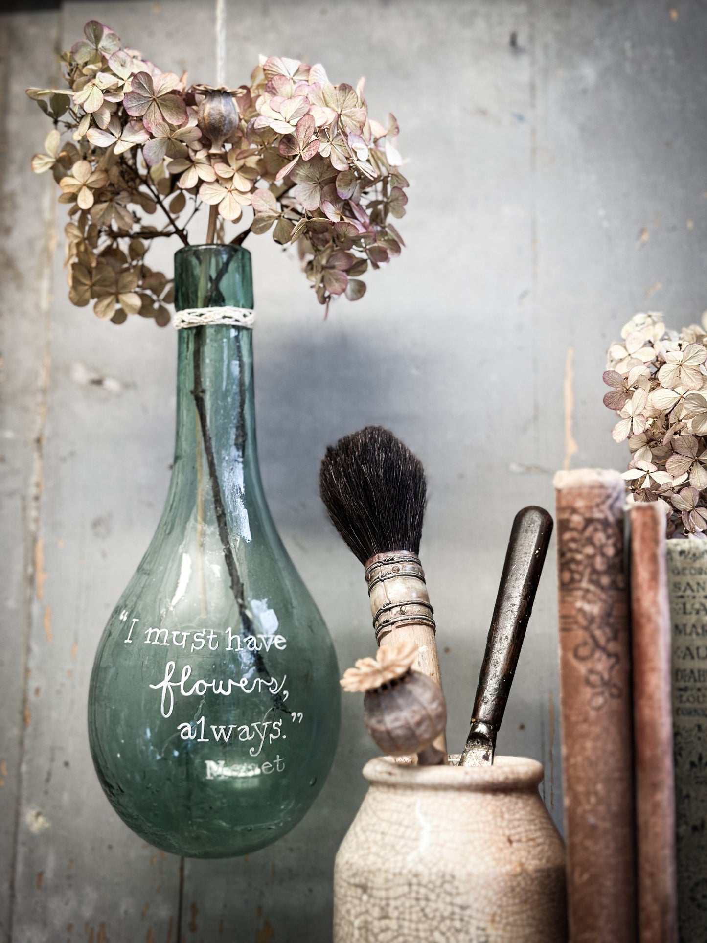 A beautiful antique hanging bulb bottle with a hand painted quote