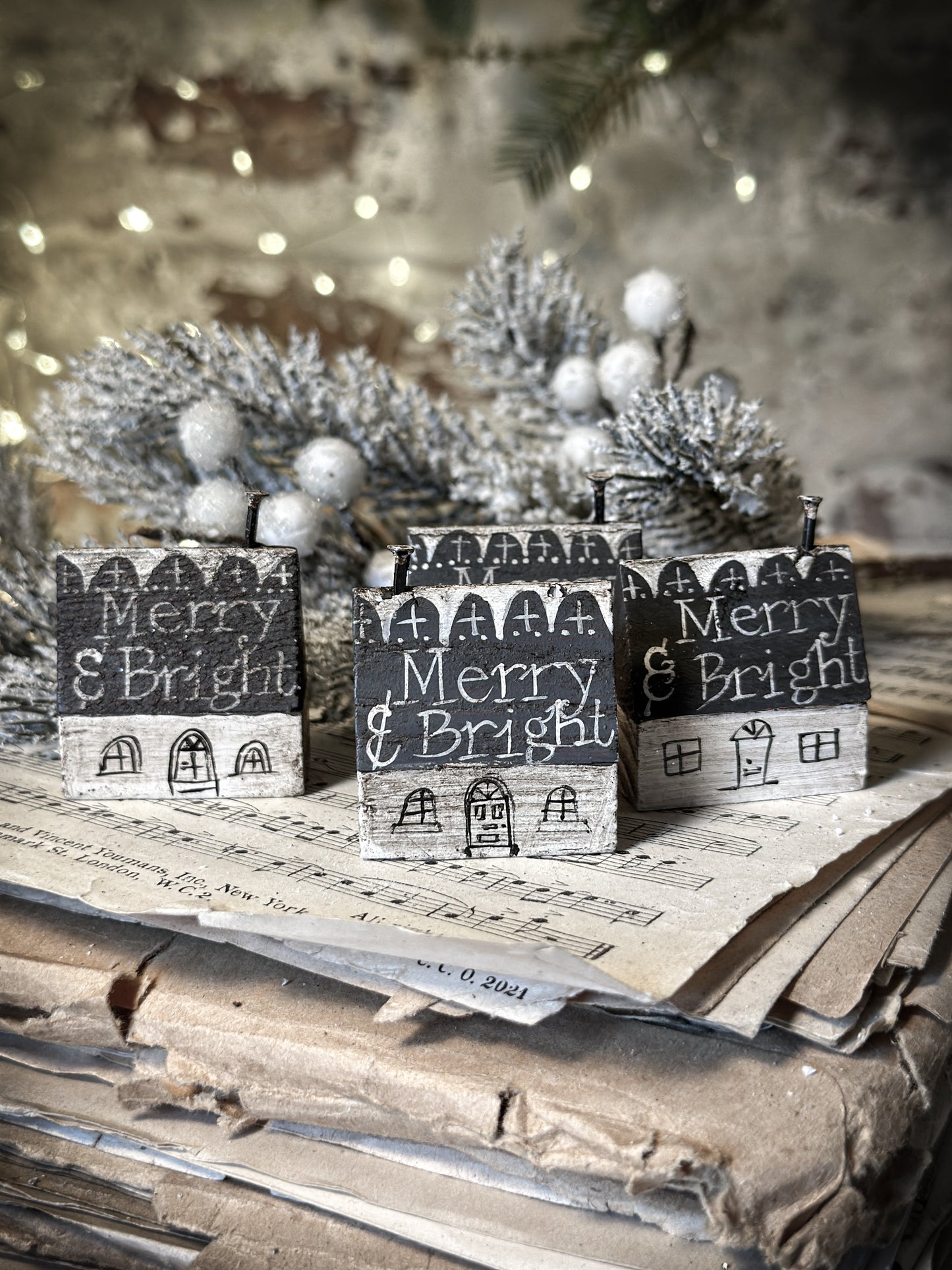 A pretty vintage German Erzgebirge Putz wooden village house painted with a Christmas quote