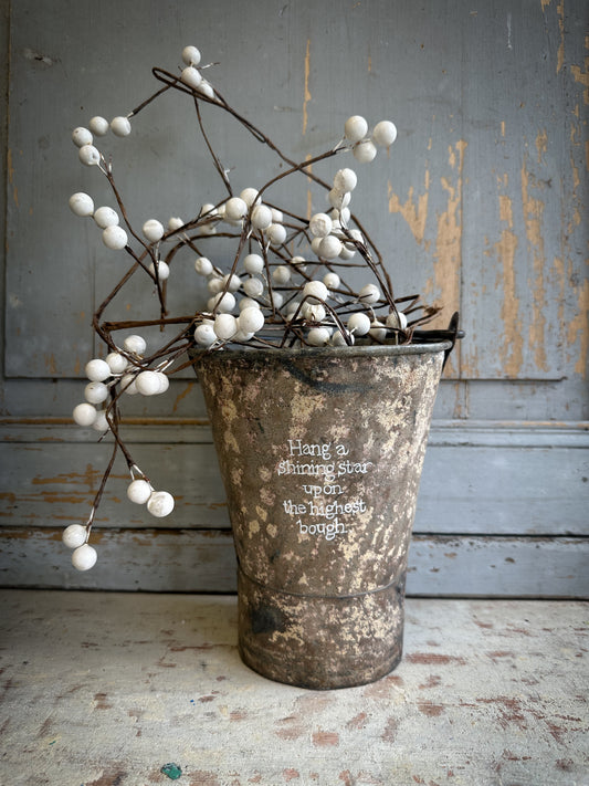 A Recycled Metal Mini Christmas Tree Bucket With A Hand Painted Quote