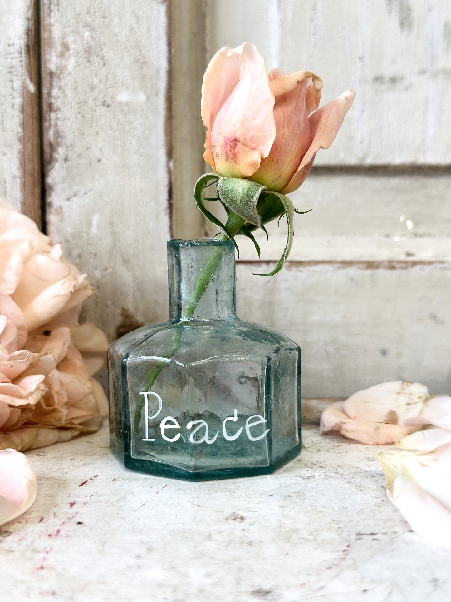 A beautiful Victorian bottle with a hand painted quote